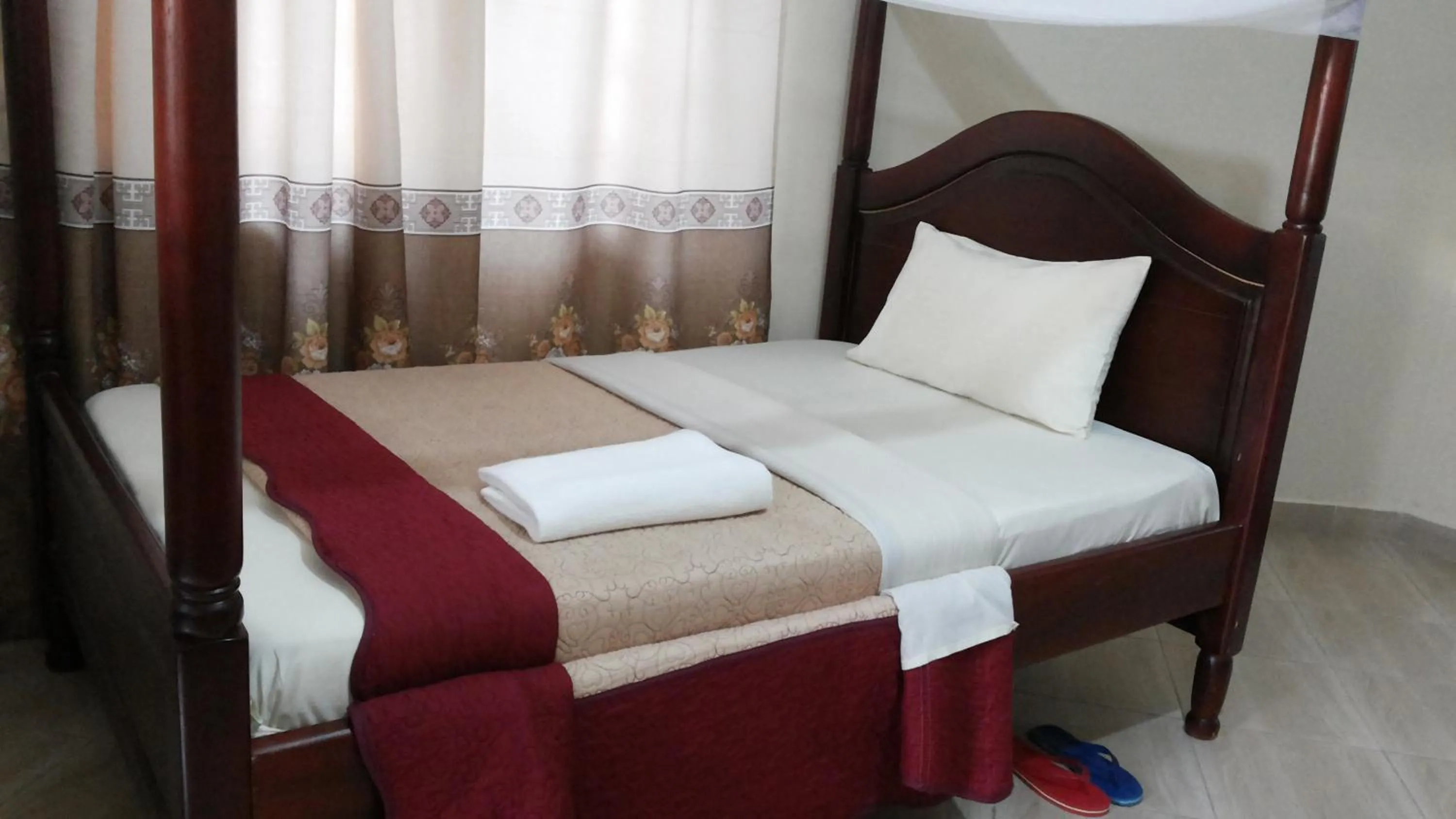 Bedroom in Kalalo Cottage Inn