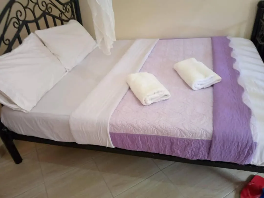 Bedroom in Kalalo Cottage Inn