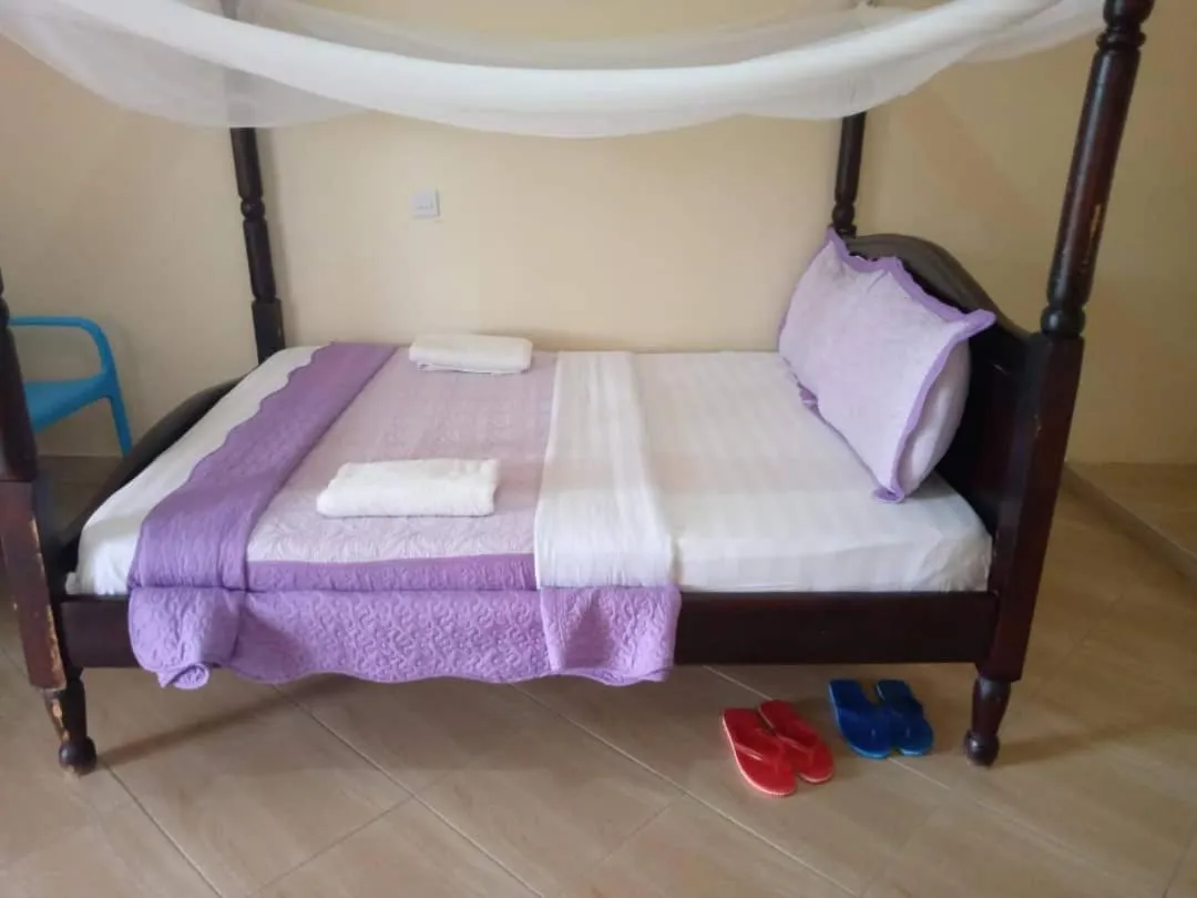 Bedroom in Kalalo Cottage Inn