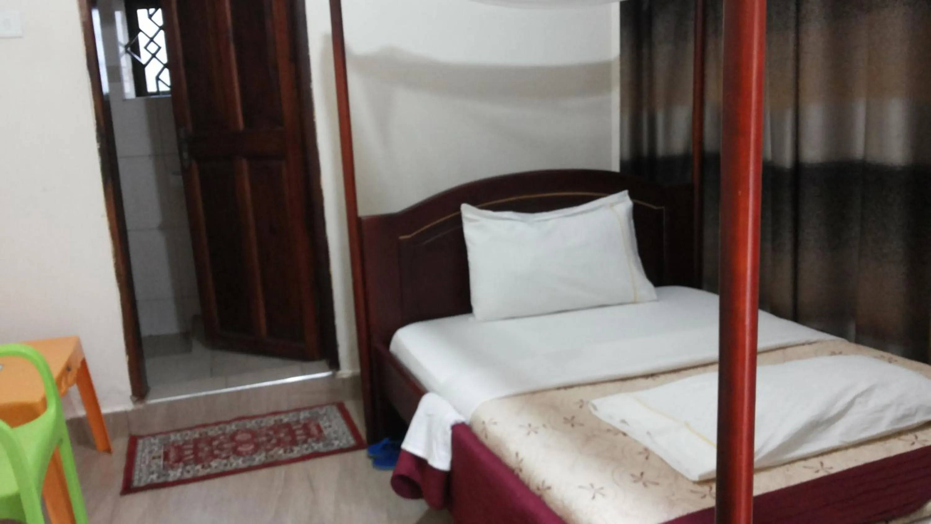 Bed in Kalalo Cottage Inn