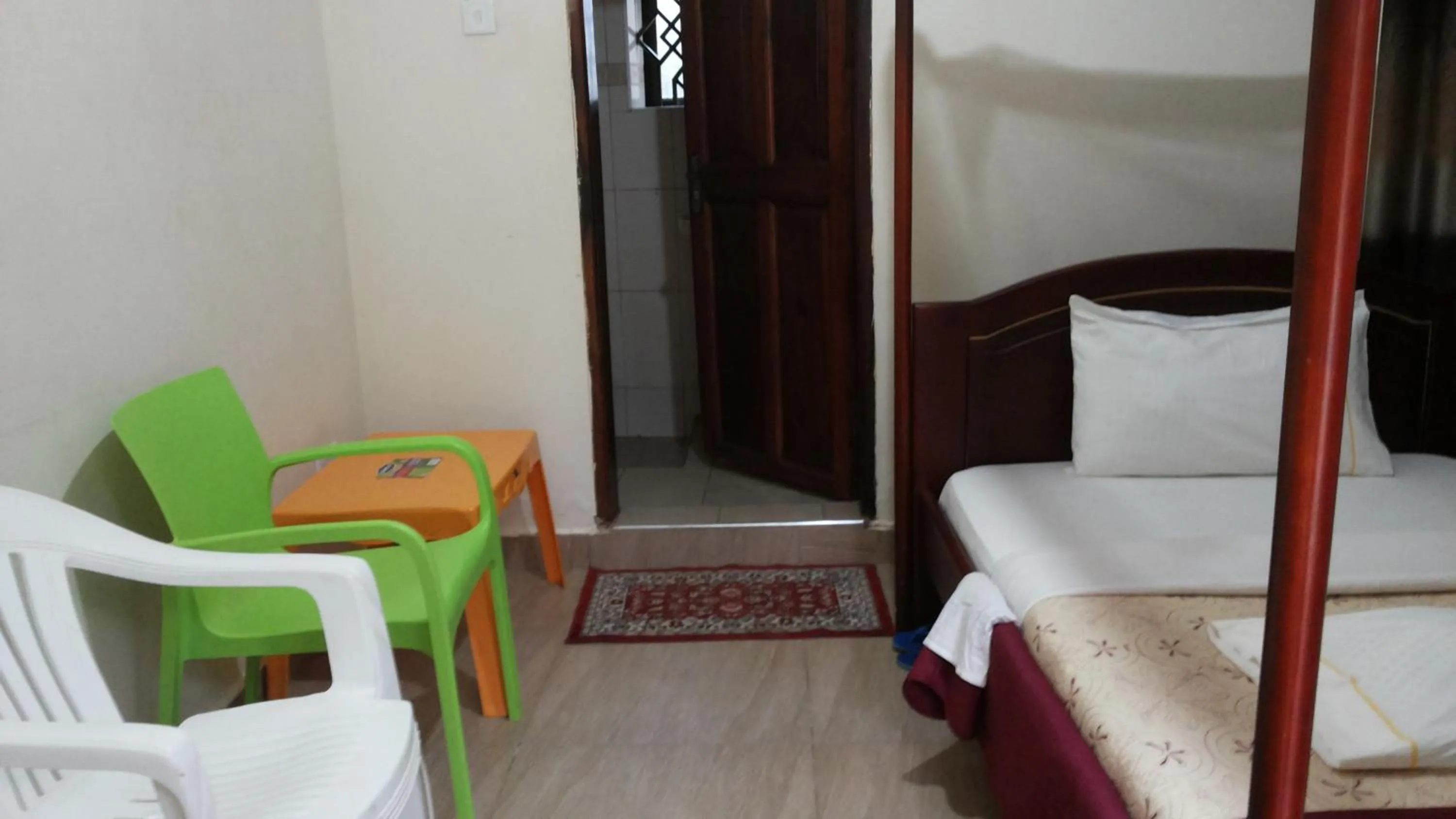 Bedroom in Kalalo Cottage Inn