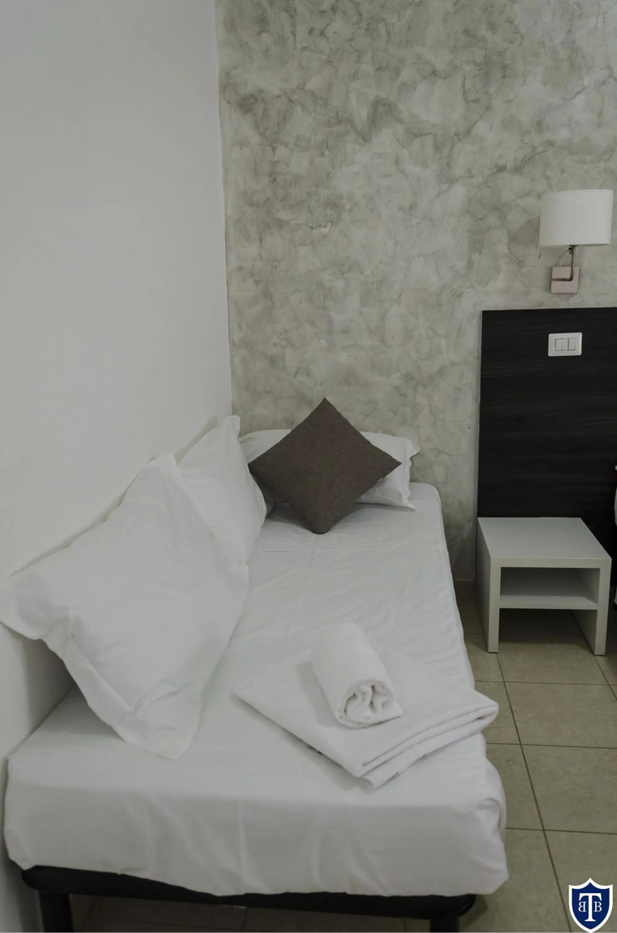 Bed in TIBURTINA INN GUEST HOUSE