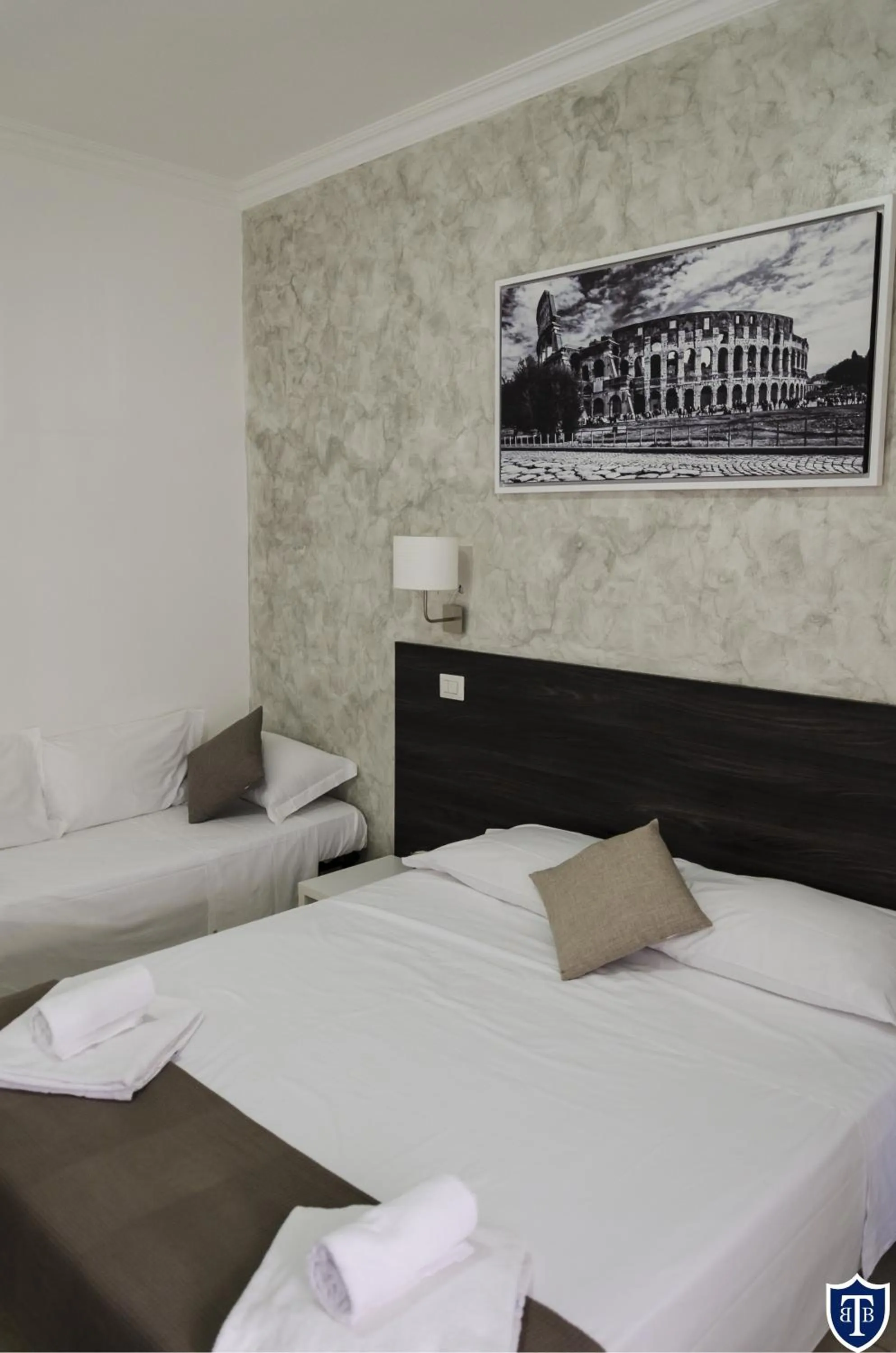 Bed in TIBURTINA INN GUEST HOUSE