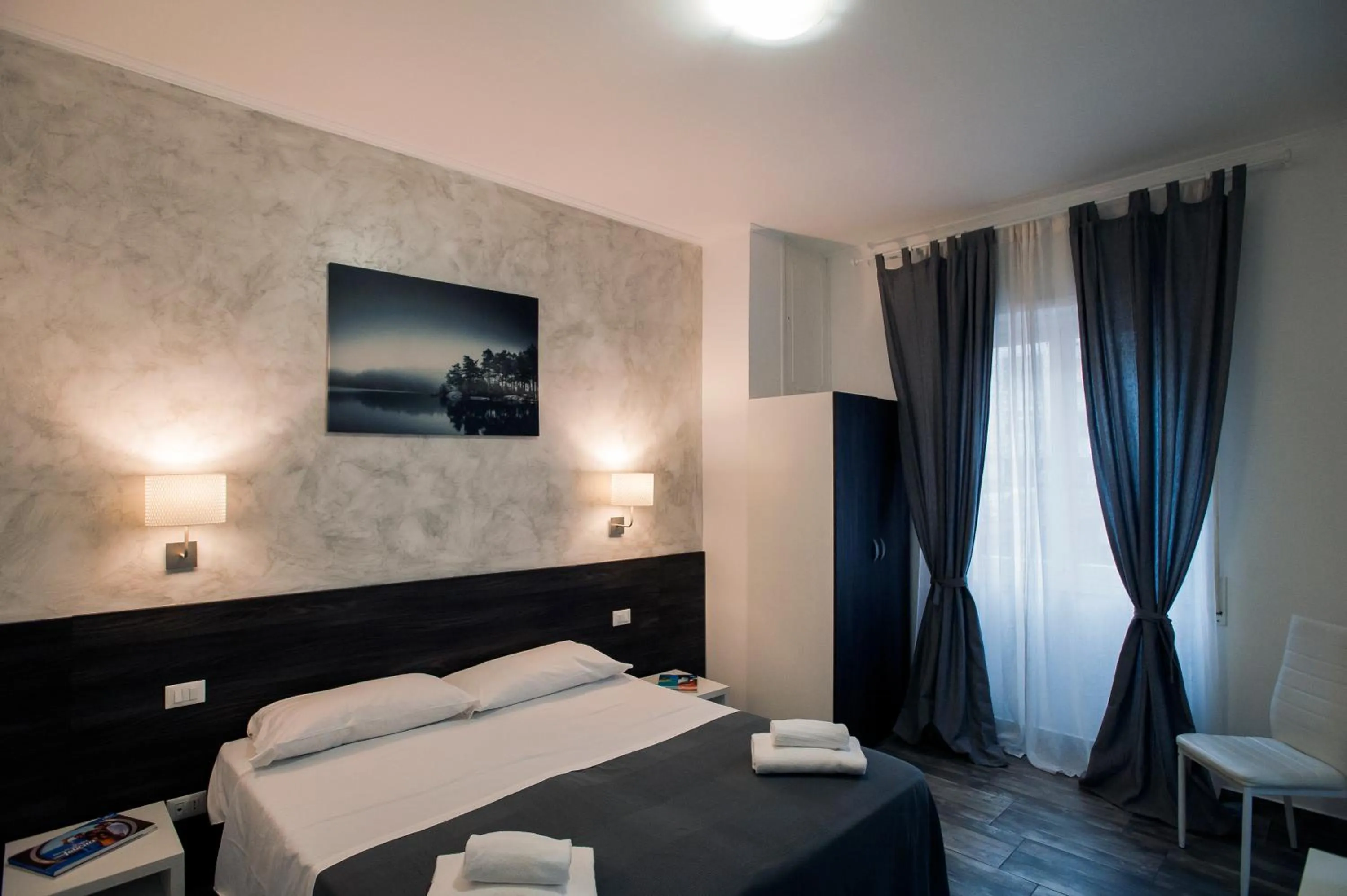 Bed in TIBURTINA INN GUEST HOUSE