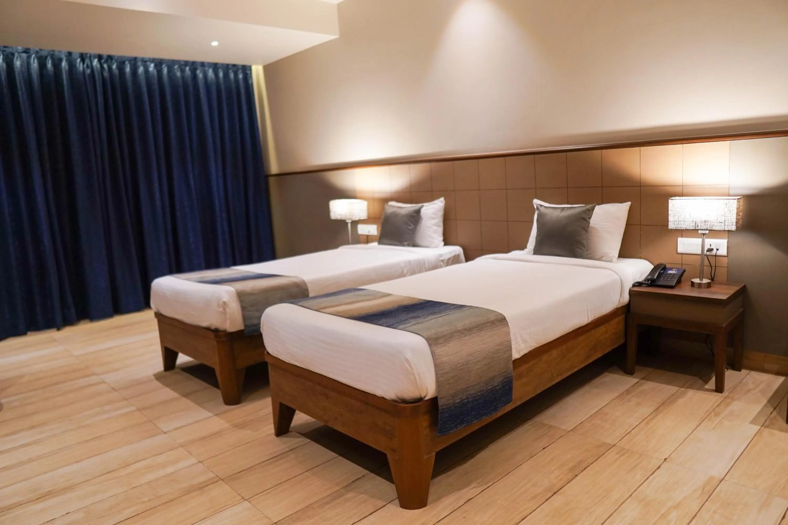 Bed in Cosmique Clarks Inn Suites Goa