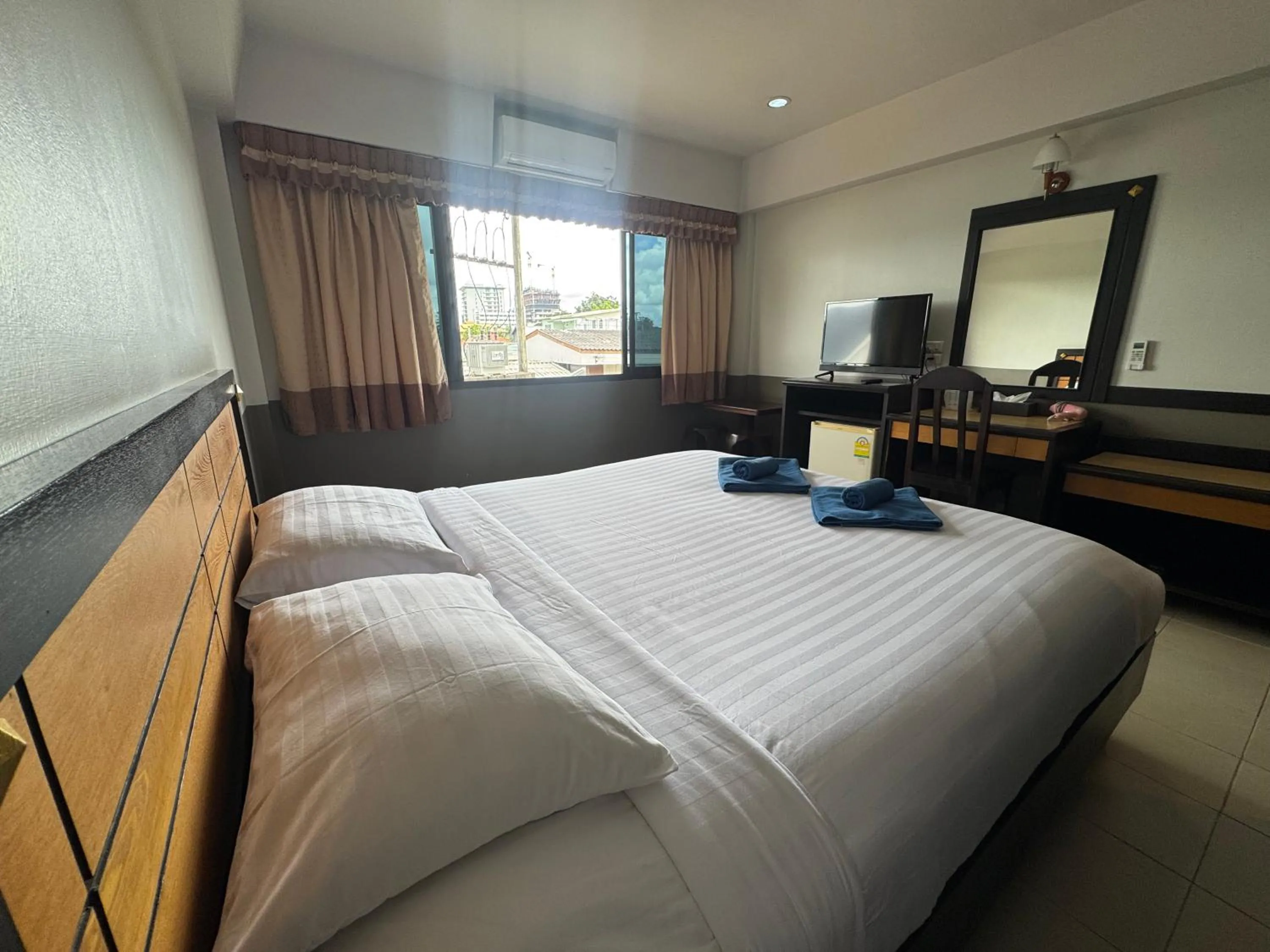 Photo of the whole room, Bed in Ariya inn Chiangrai