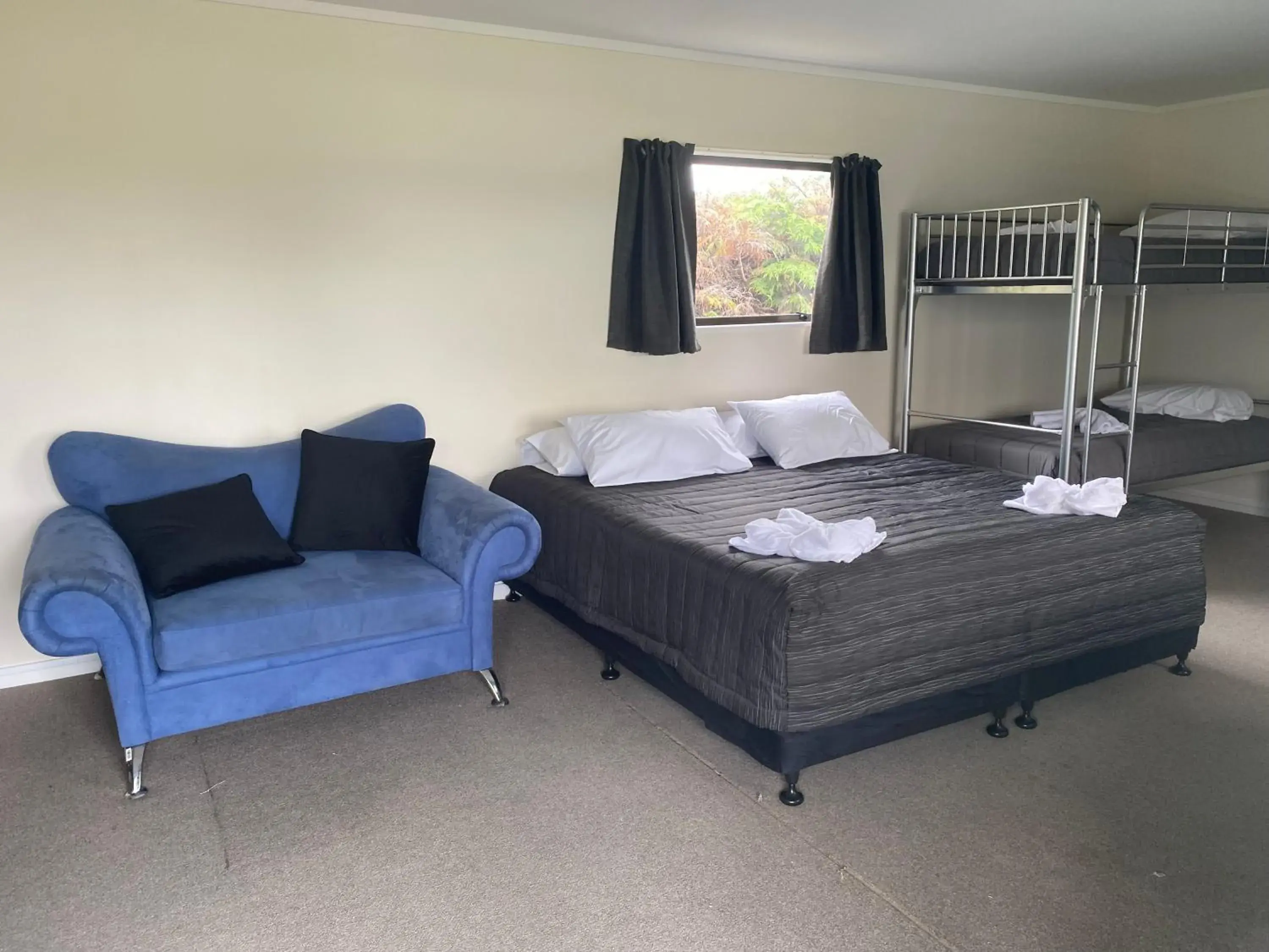 Photo of the whole room, Bed in Rotorua Thermal Holiday Park Photo of the whole room, Bed in Rotorua Thermal Holiday Park