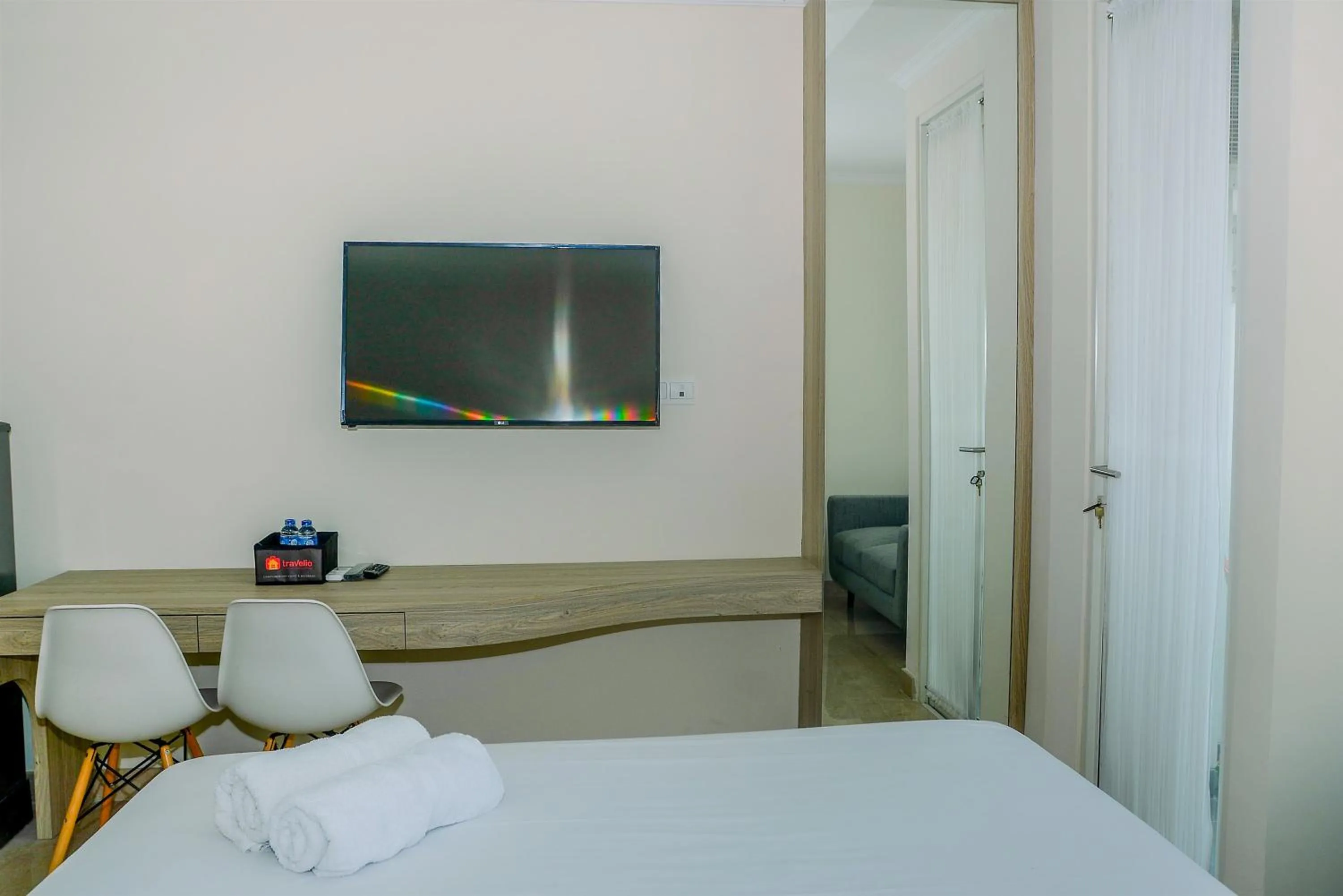 Bed in Modern and Cozy Studio Menteng Park Apartment By Travelio