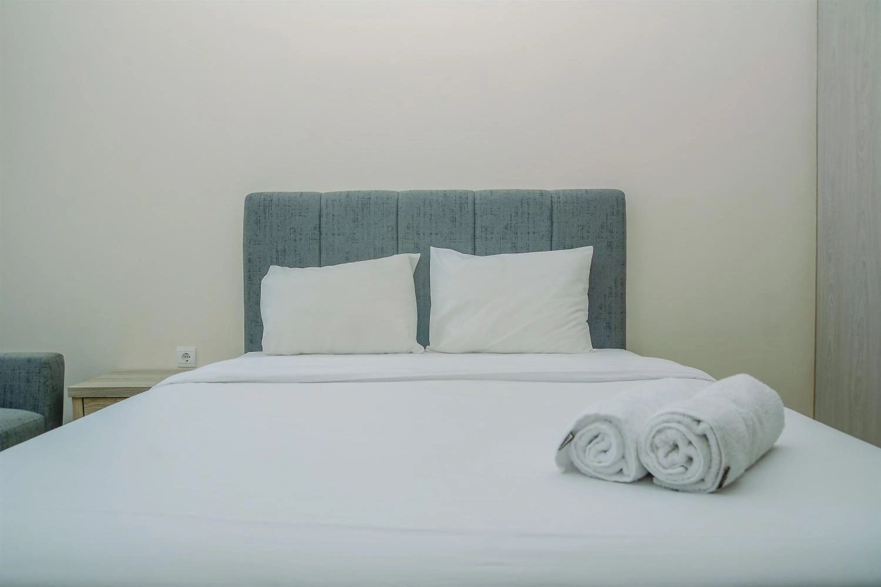 Bed in Modern and Cozy Studio Menteng Park Apartment By Travelio
