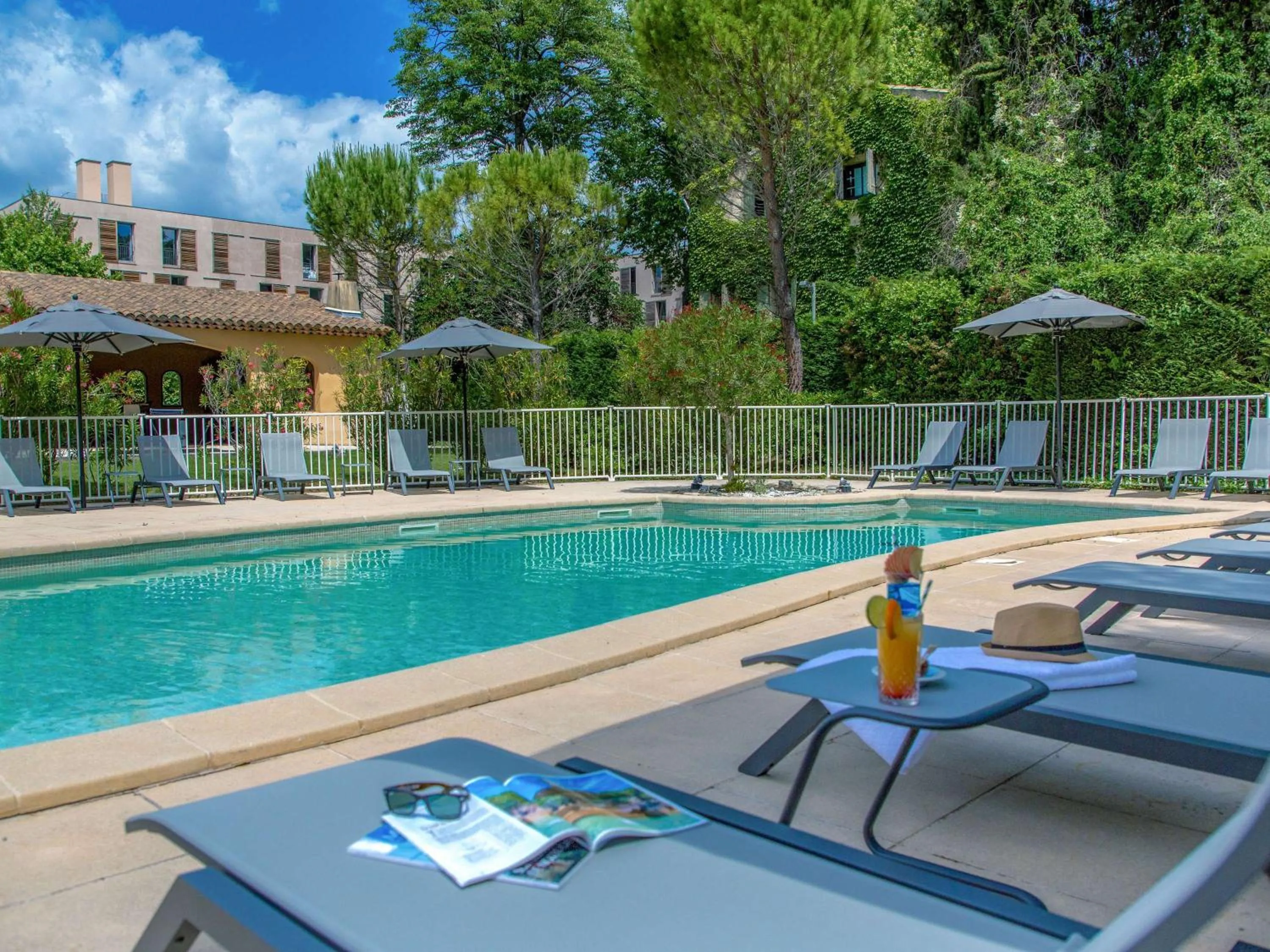 Pool view in Novotel Aix-en-Provence Pont de L'Arc