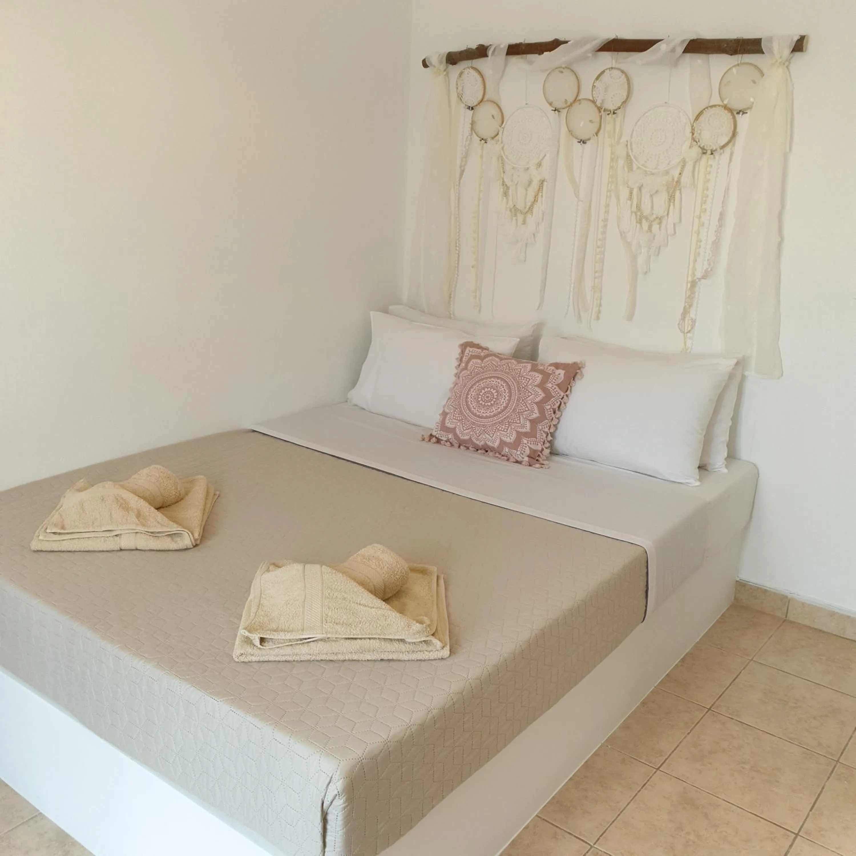 Bed in Sagma Central Rooms