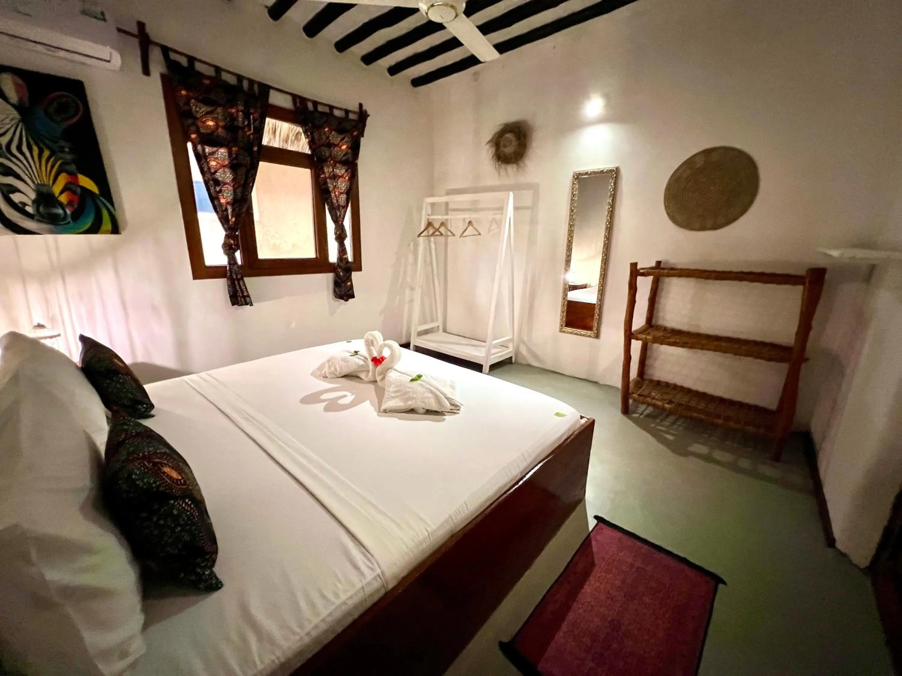 Bed in The African Paradise Beach Hotel