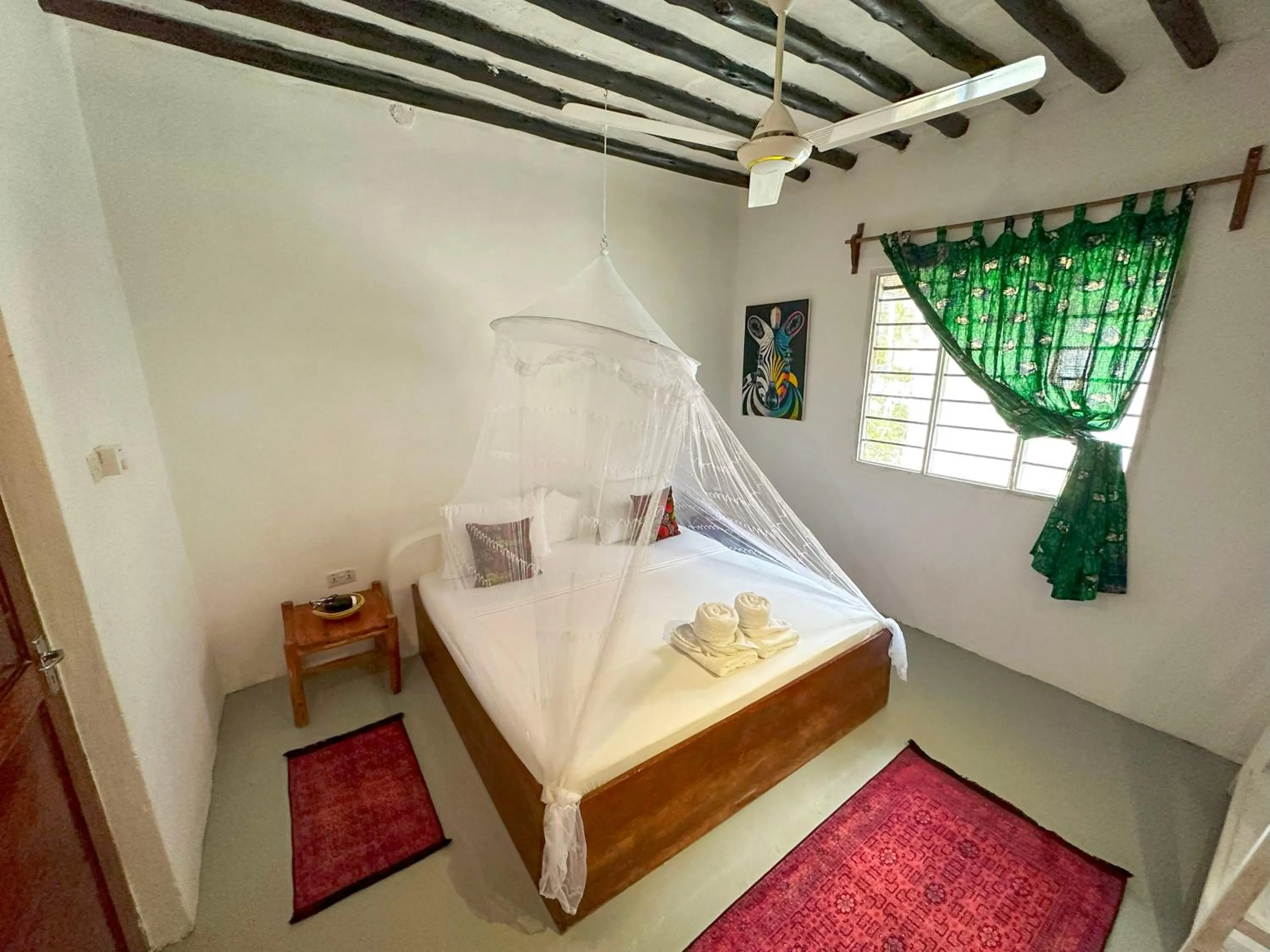 Bed in The African Paradise Beach Hotel