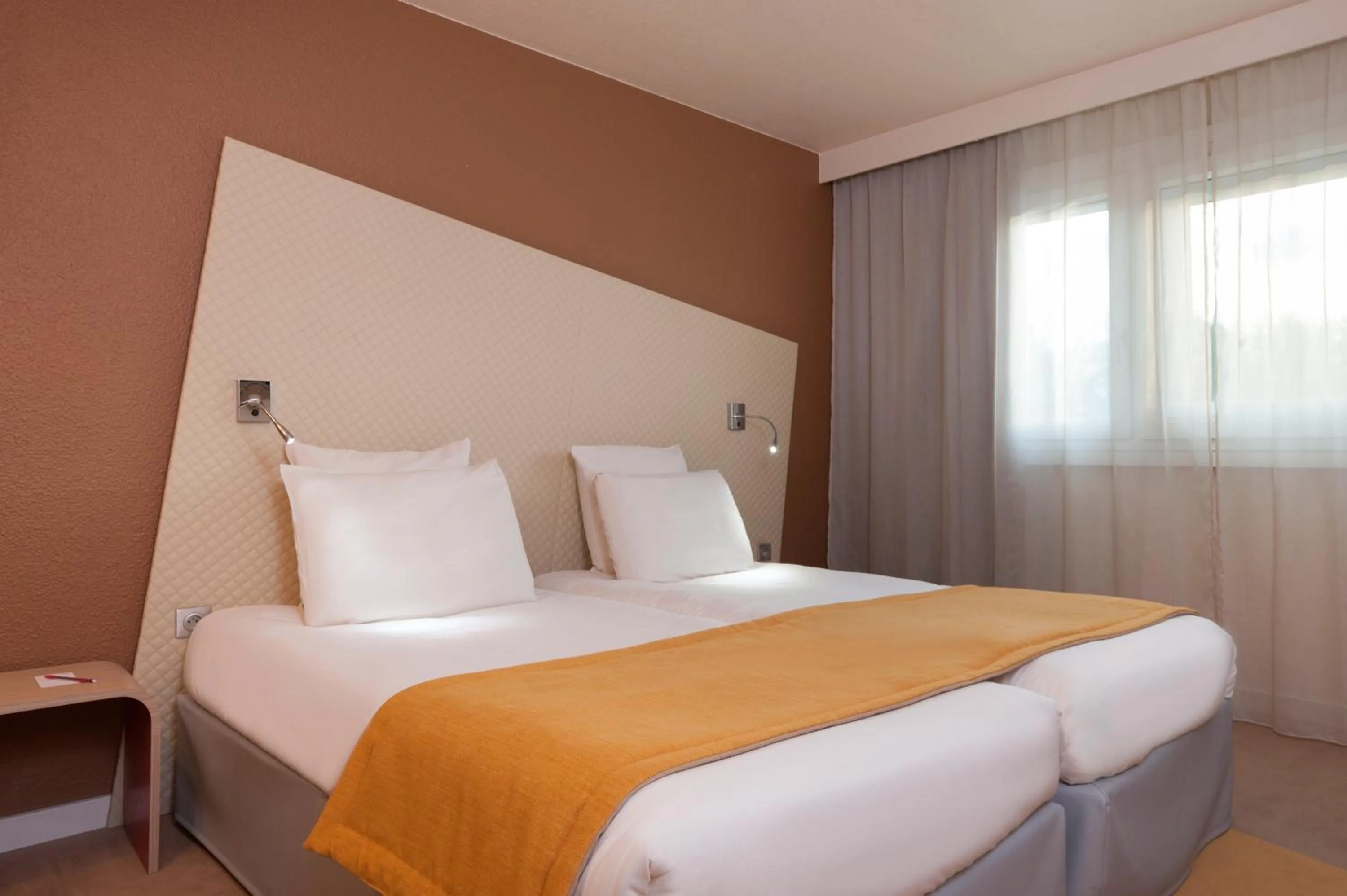Bed in Mercure Paris Le Bourget Aeroport