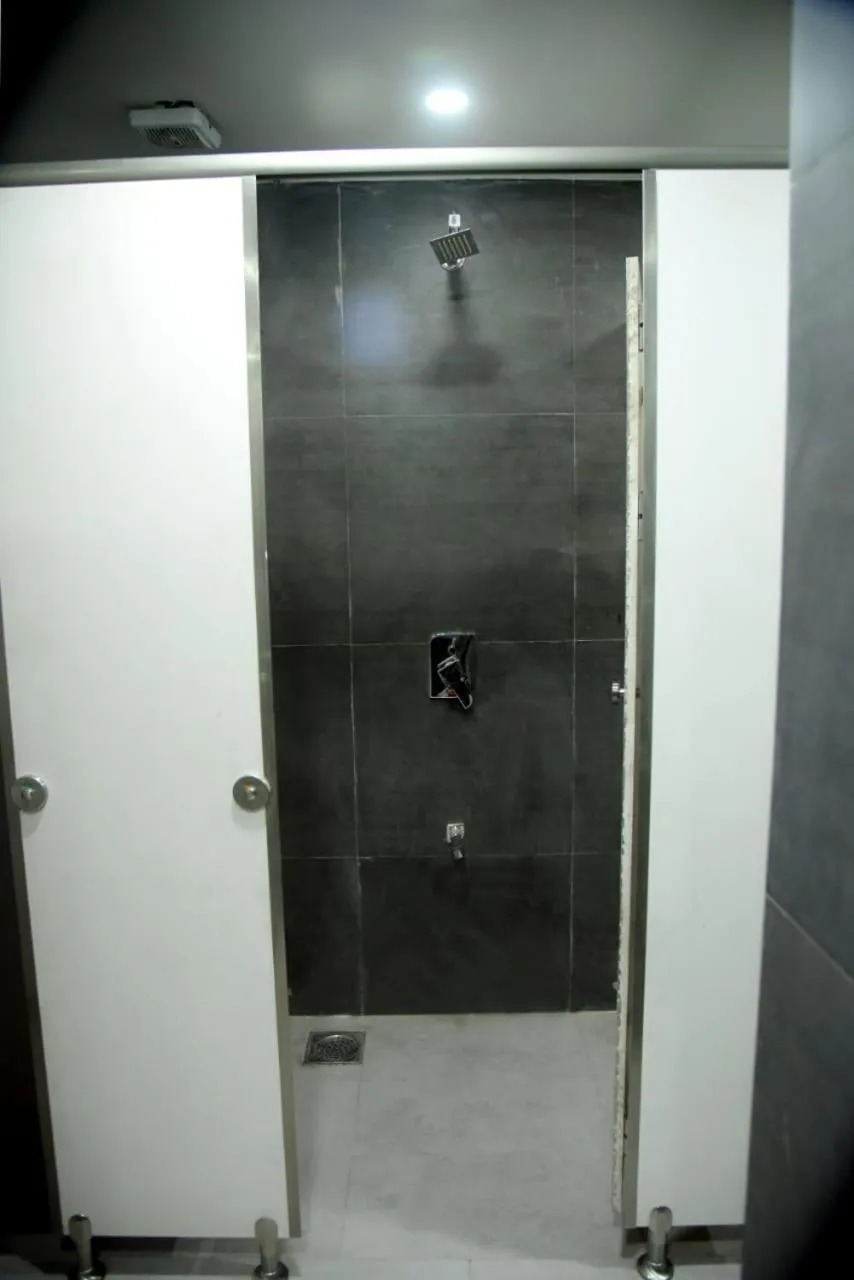 Bathroom in CHARYANA HOTEL AC DORMITORY