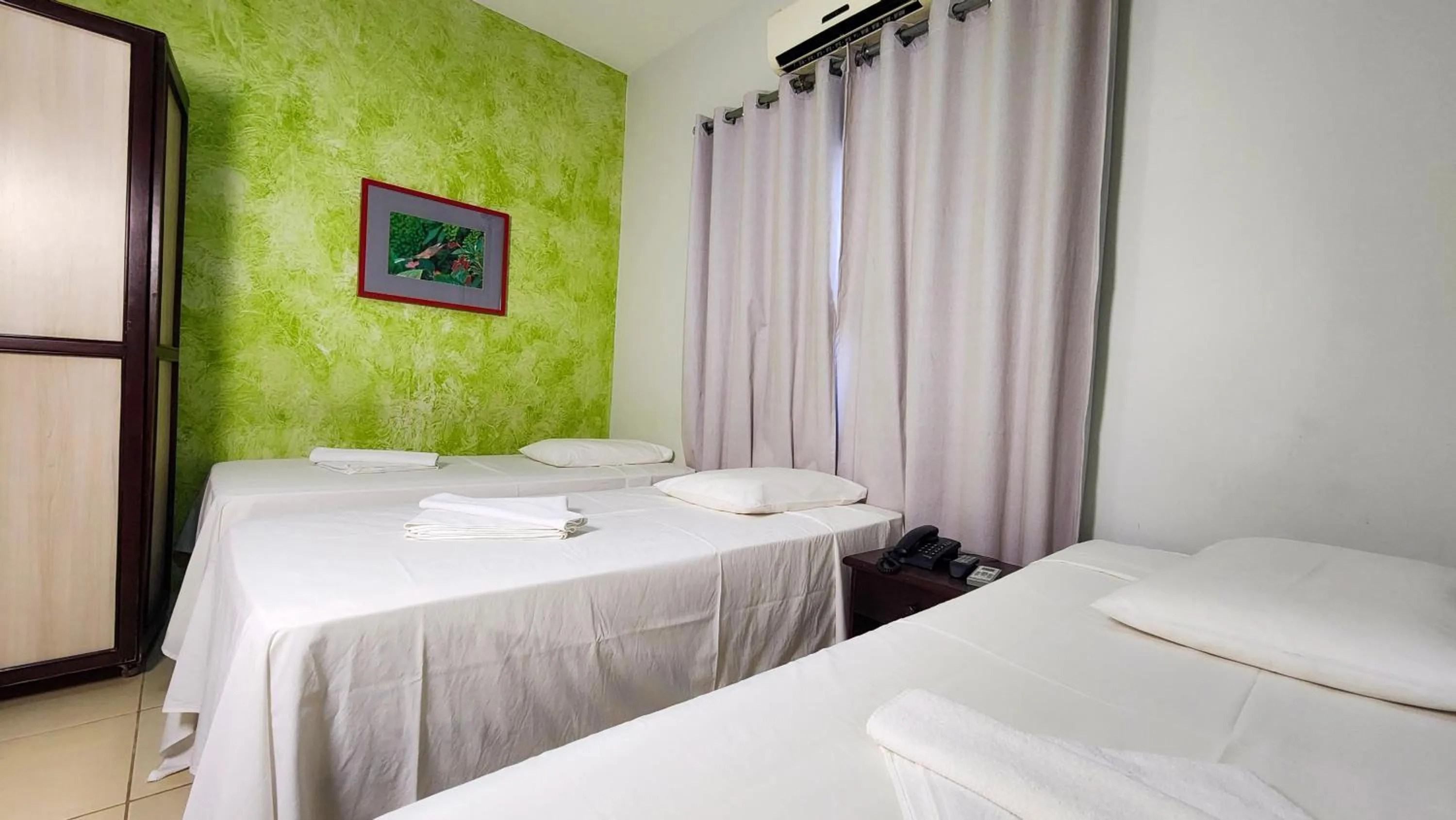 Bed in Hotel Pousada Calliandra