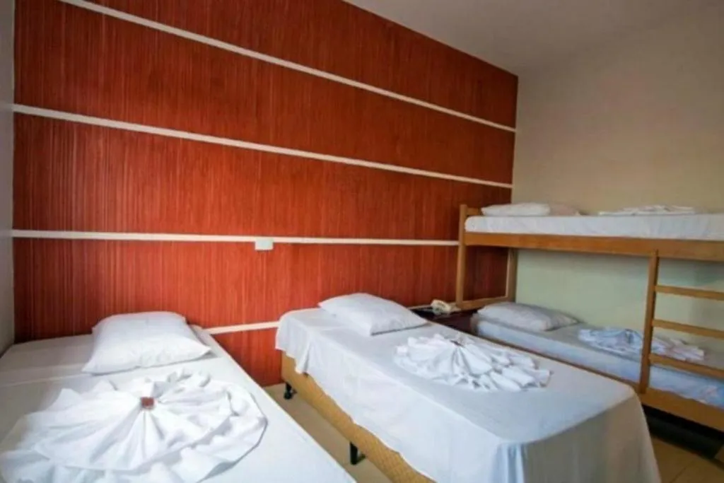 Bed in Hotel Pousada Calliandra