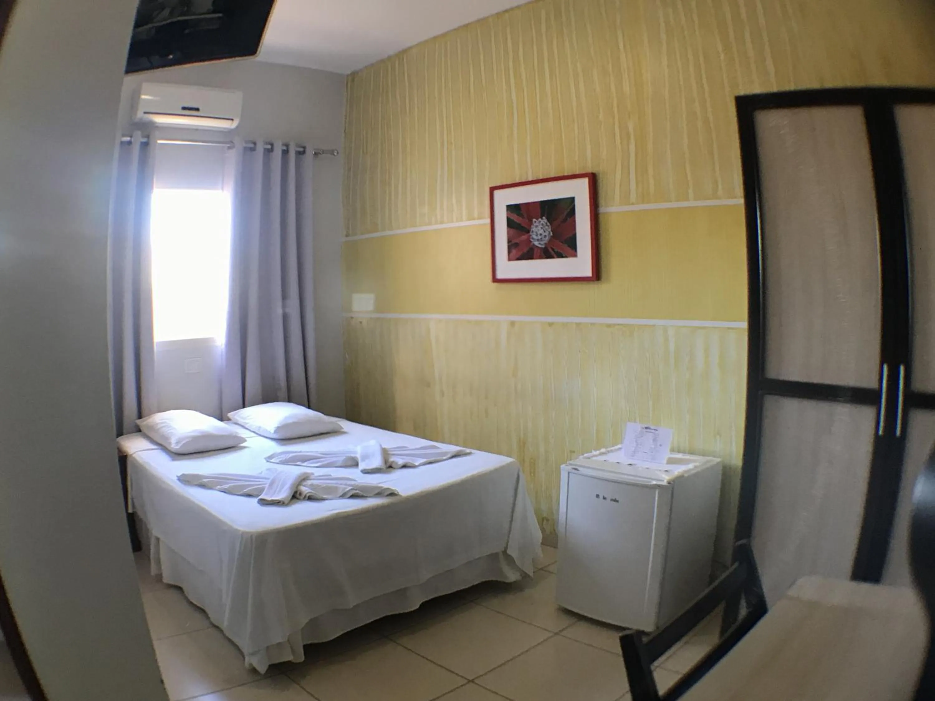 Bed in Hotel Pousada Calliandra