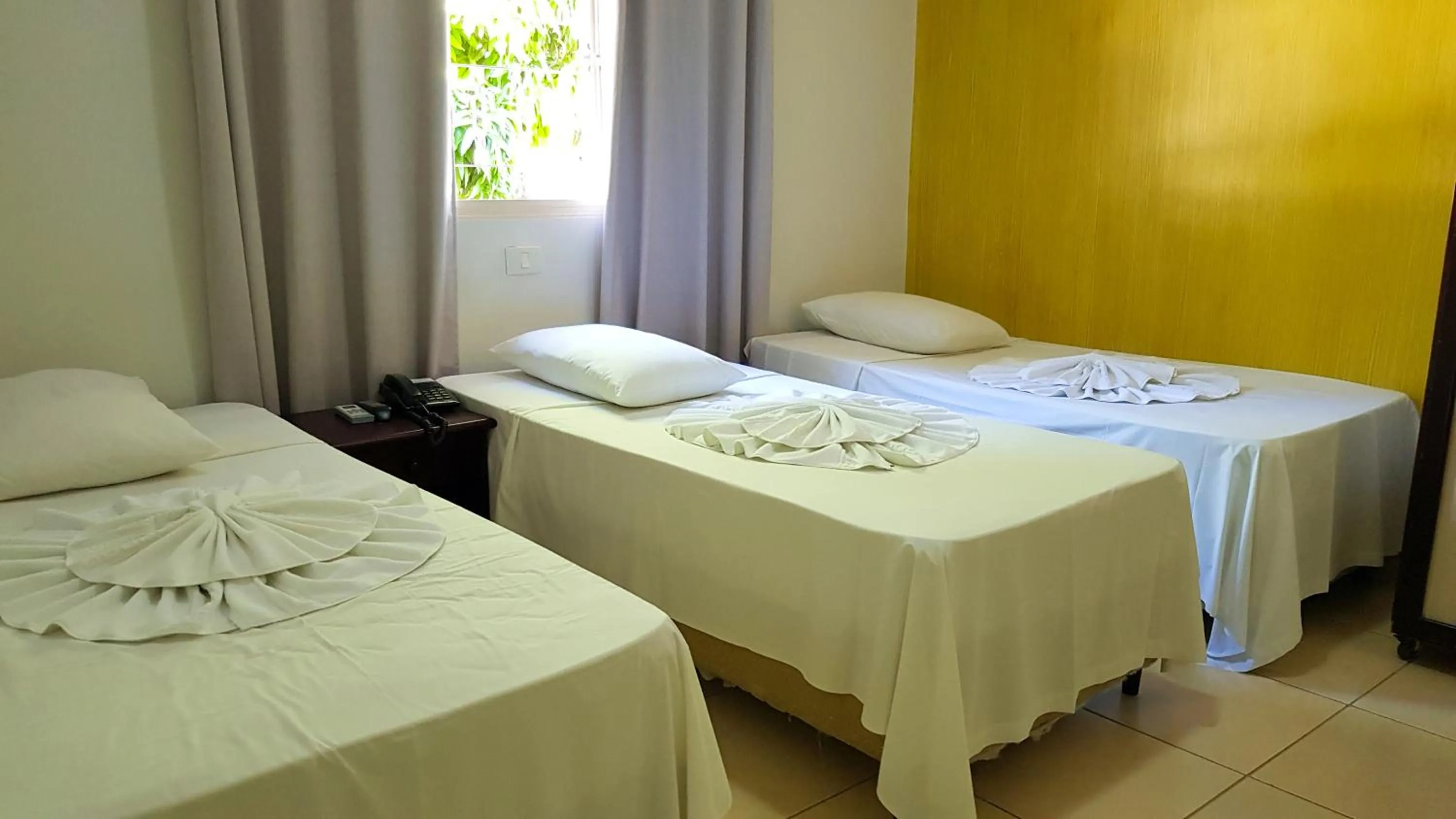 Bed in Hotel Pousada Calliandra