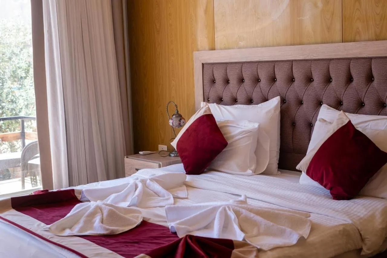 Bed in Al Sultana Luxury Camp