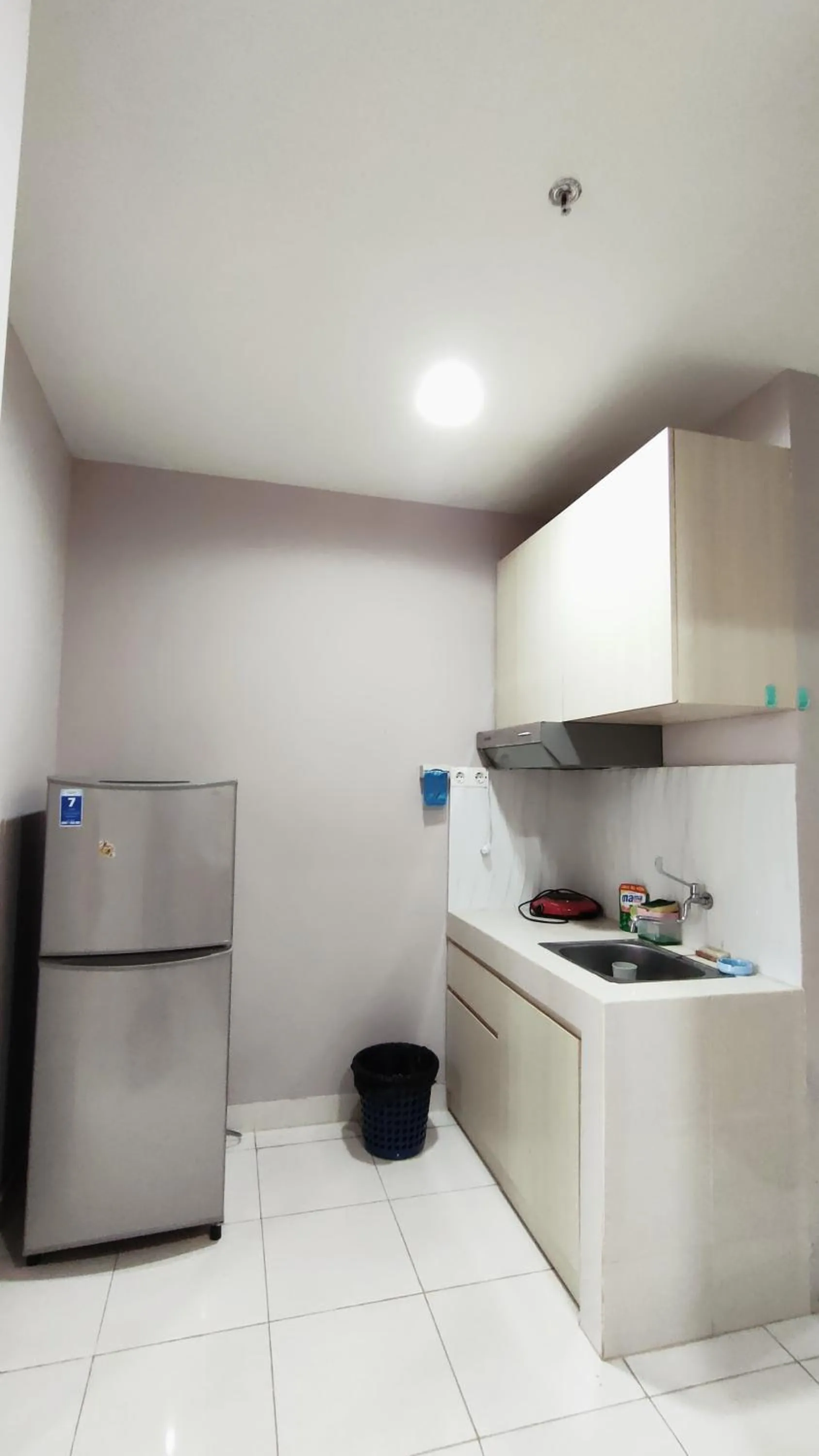 Kitchen or kitchenette in Kozy Room Sentul Tower Apartemen