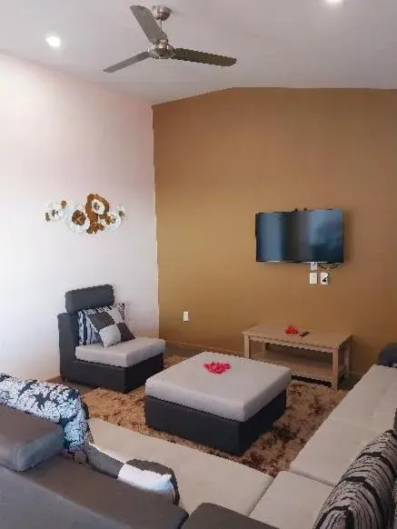 Living room, Bed in Le Uaina Beach Resort Living room, Bed in Le Uaina Beach Resort