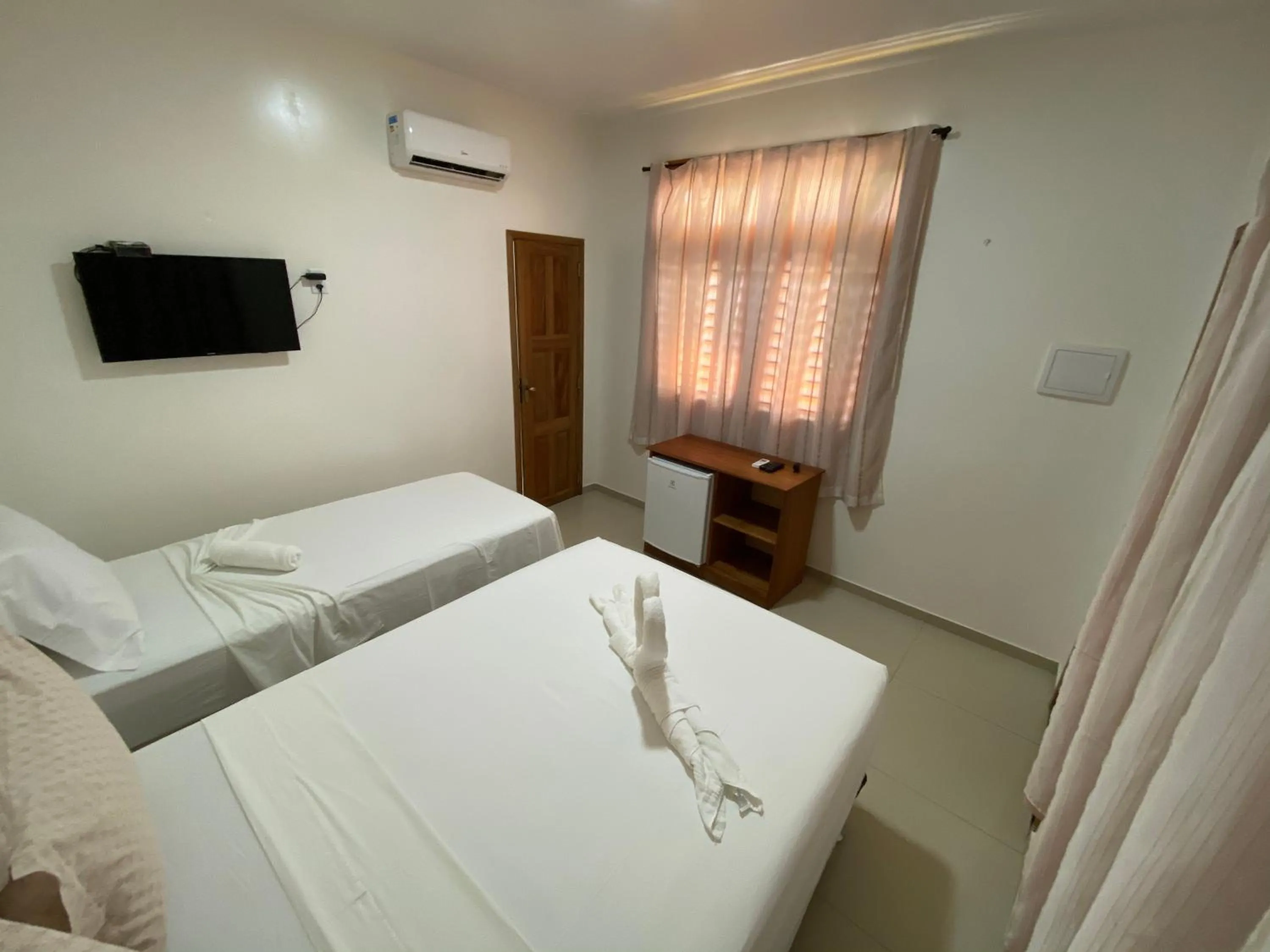 Bed in Pousada Casa da Cion