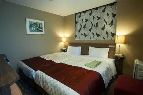 Photo of the whole room, Bed in Hiroshima Intelligent Hotel Stadium Mae