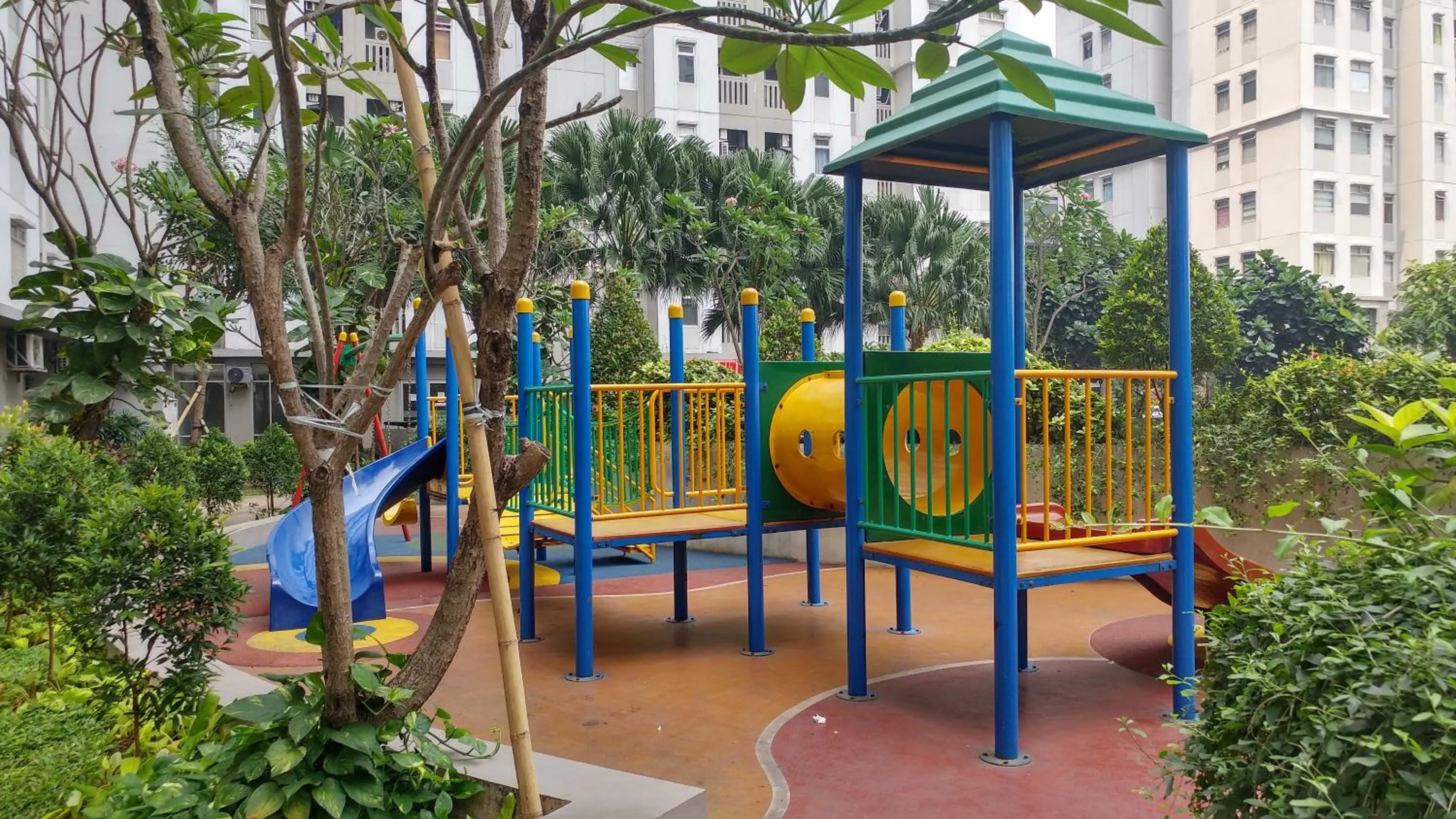 Children play ground in Green Bay Pluit Studio Apartment with 2 Single Beds By Travelio