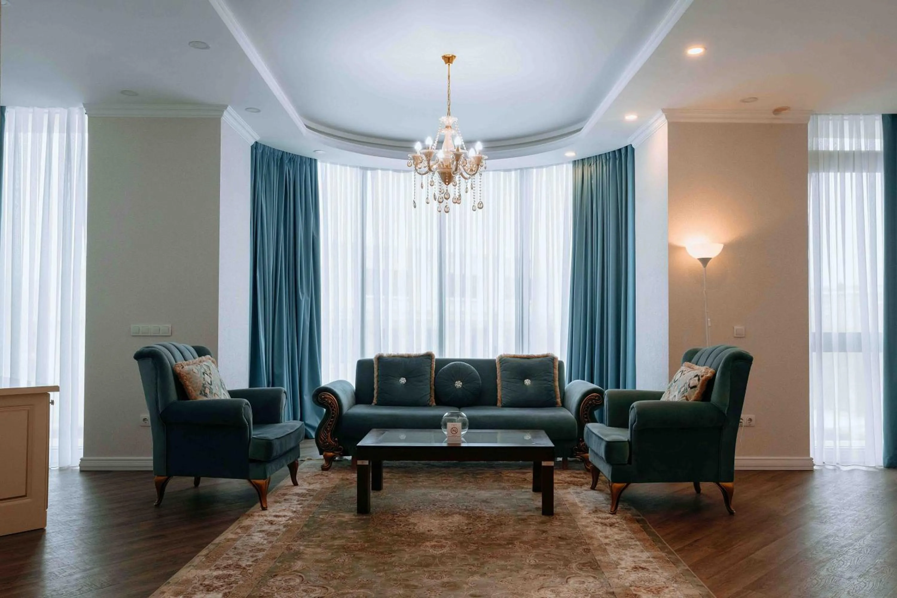 Living room in Ramada by Wyndham Shymkent