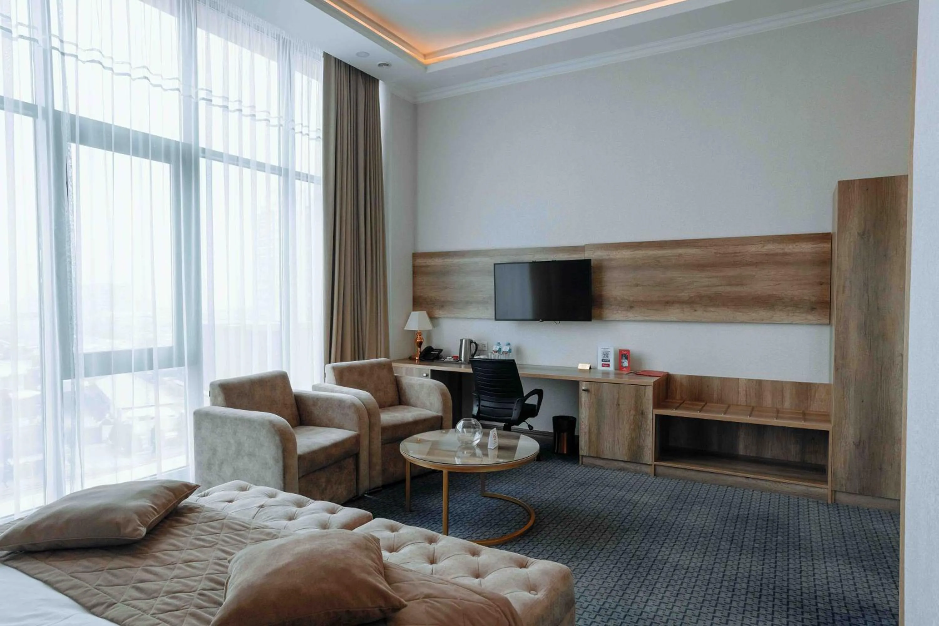 Bed in Ramada by Wyndham Shymkent