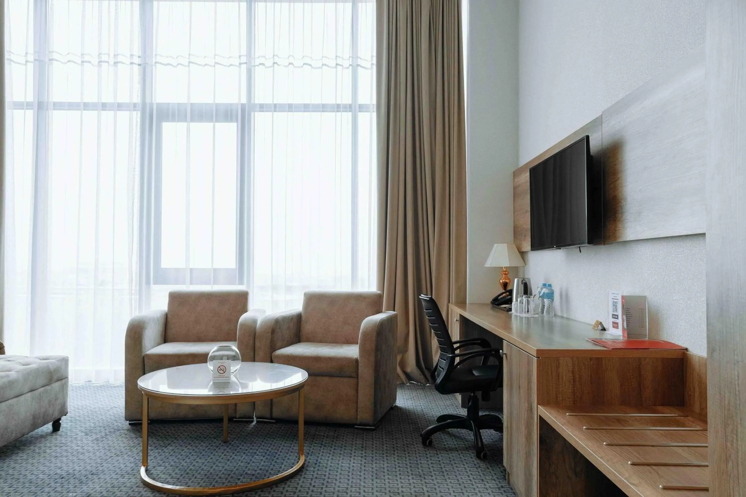 TV and multimedia in Ramada by Wyndham Shymkent