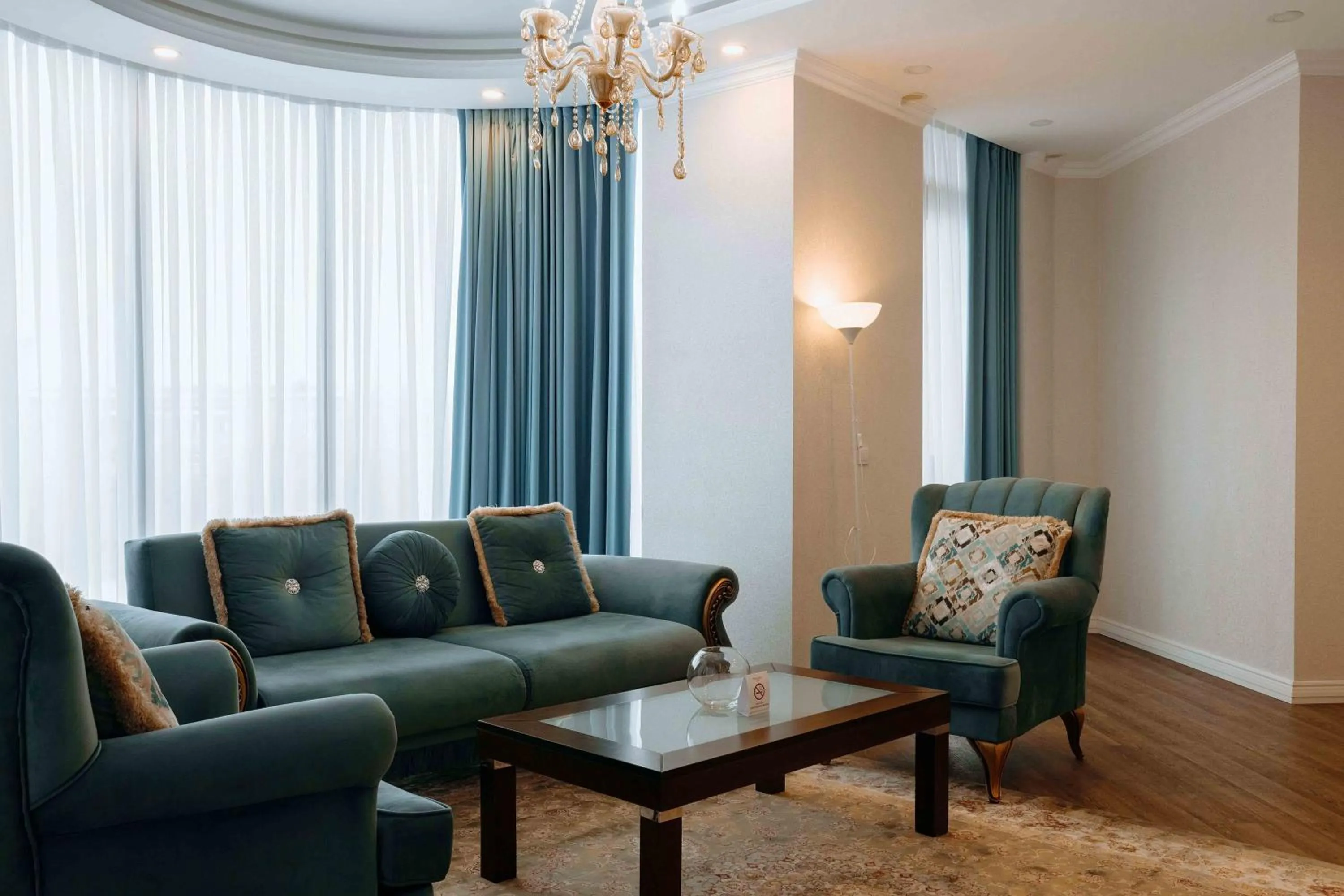 Living room in Ramada by Wyndham Shymkent