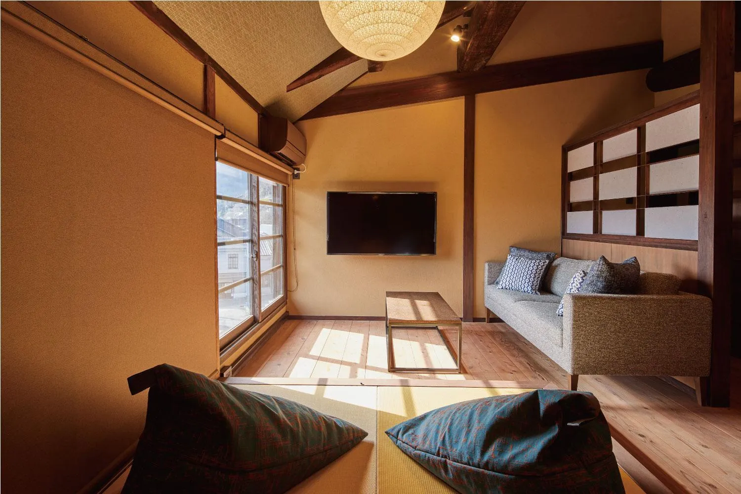Living room, Bed in Tomonoura Shiomachi Hotel