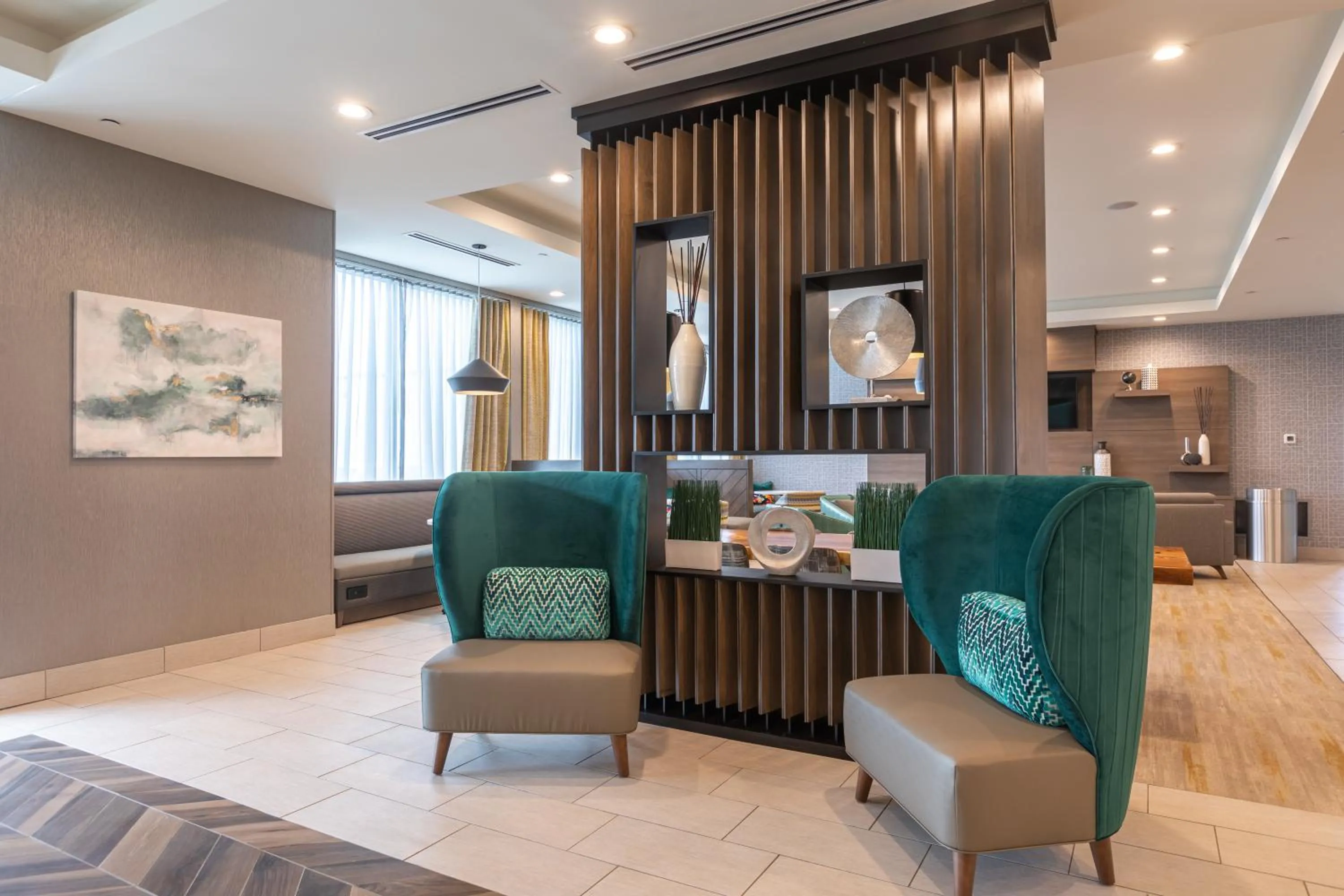 Communal lounge/ TV room in Holiday Inn Greenville - Woodruff Road by IHG