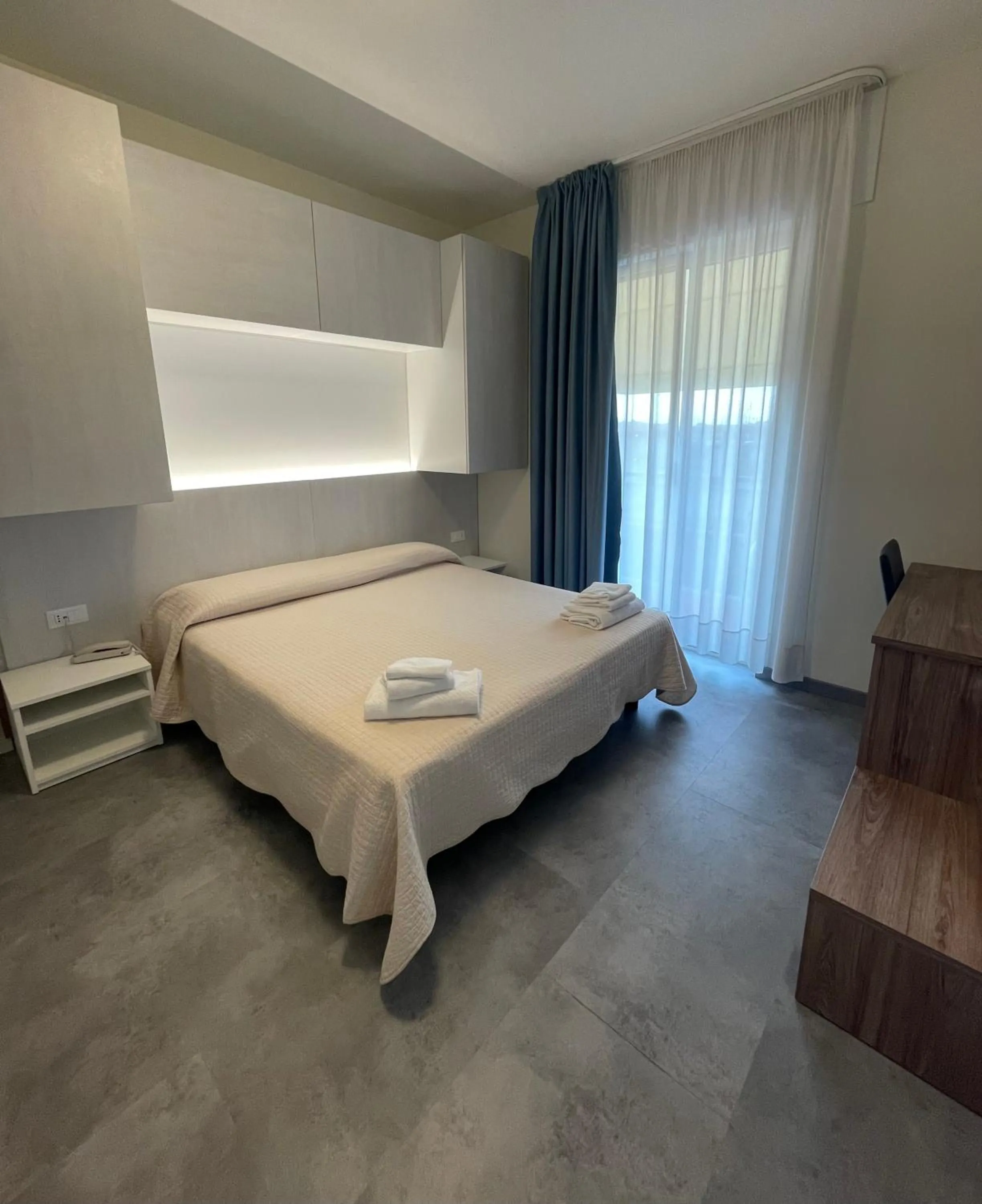 Bed in Hotel Catto Suisse