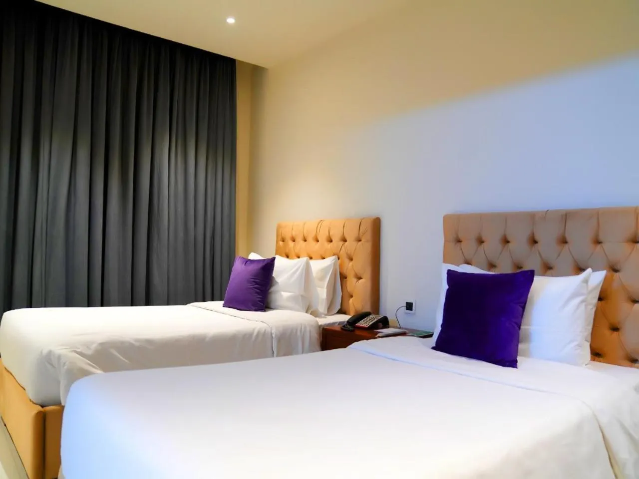 Bed in Indigo Heights Hotel & Suites