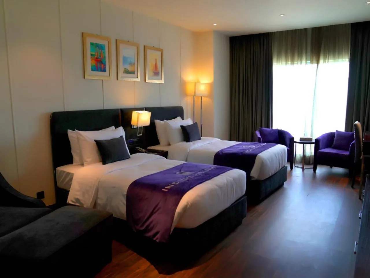 Bed in Indigo Heights Hotel & Suites