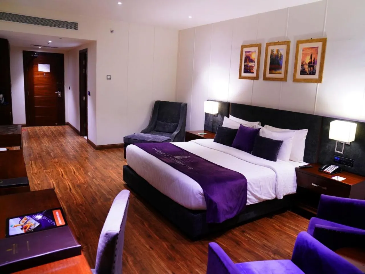 Bed in Indigo Heights Hotel & Suites