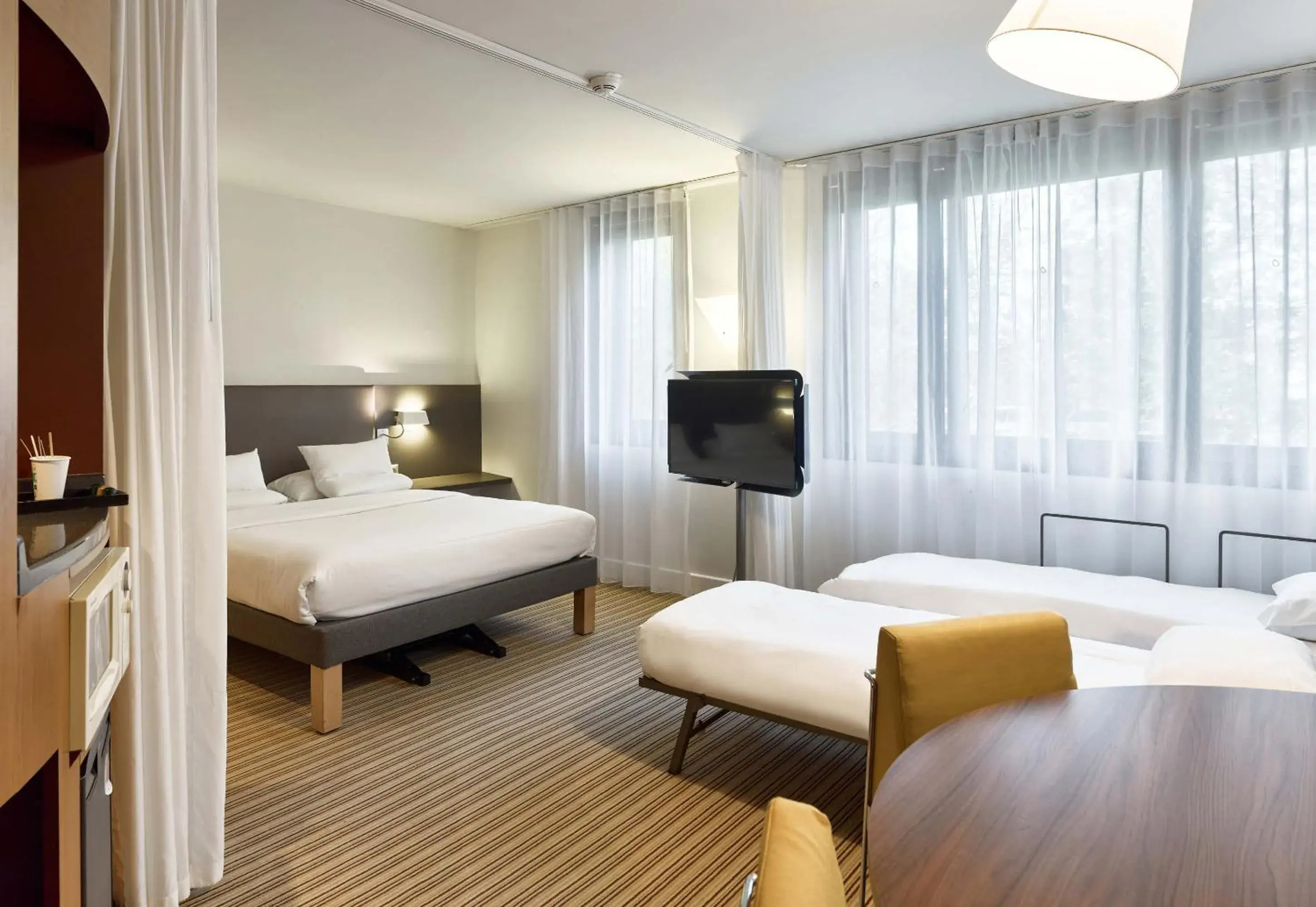 Photo of the whole room, Bed in Novotel Suites Paris Velizy