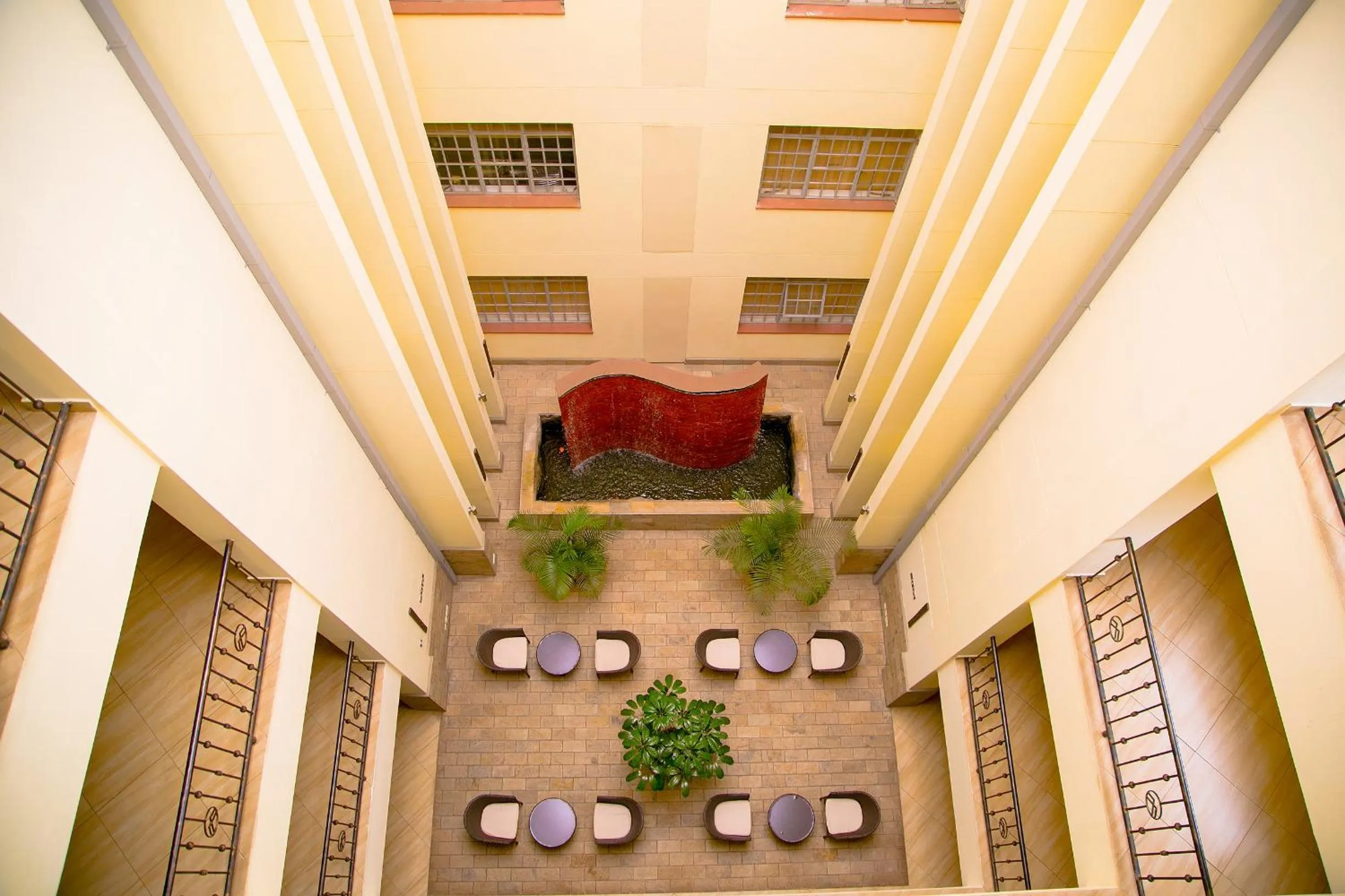 Communal lounge/ TV room in Batians Apartment Hotel