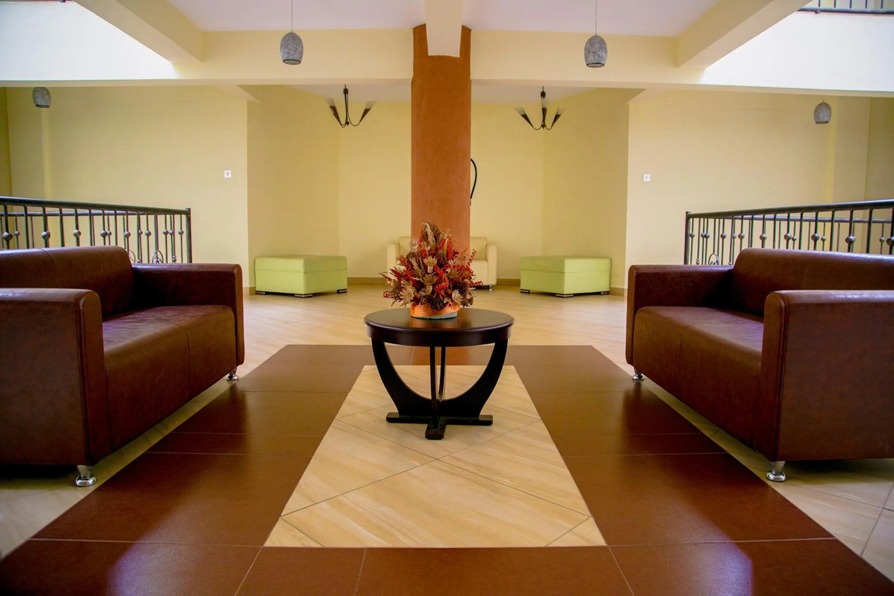 Communal lounge/ TV room in Batians Apartment Hotel