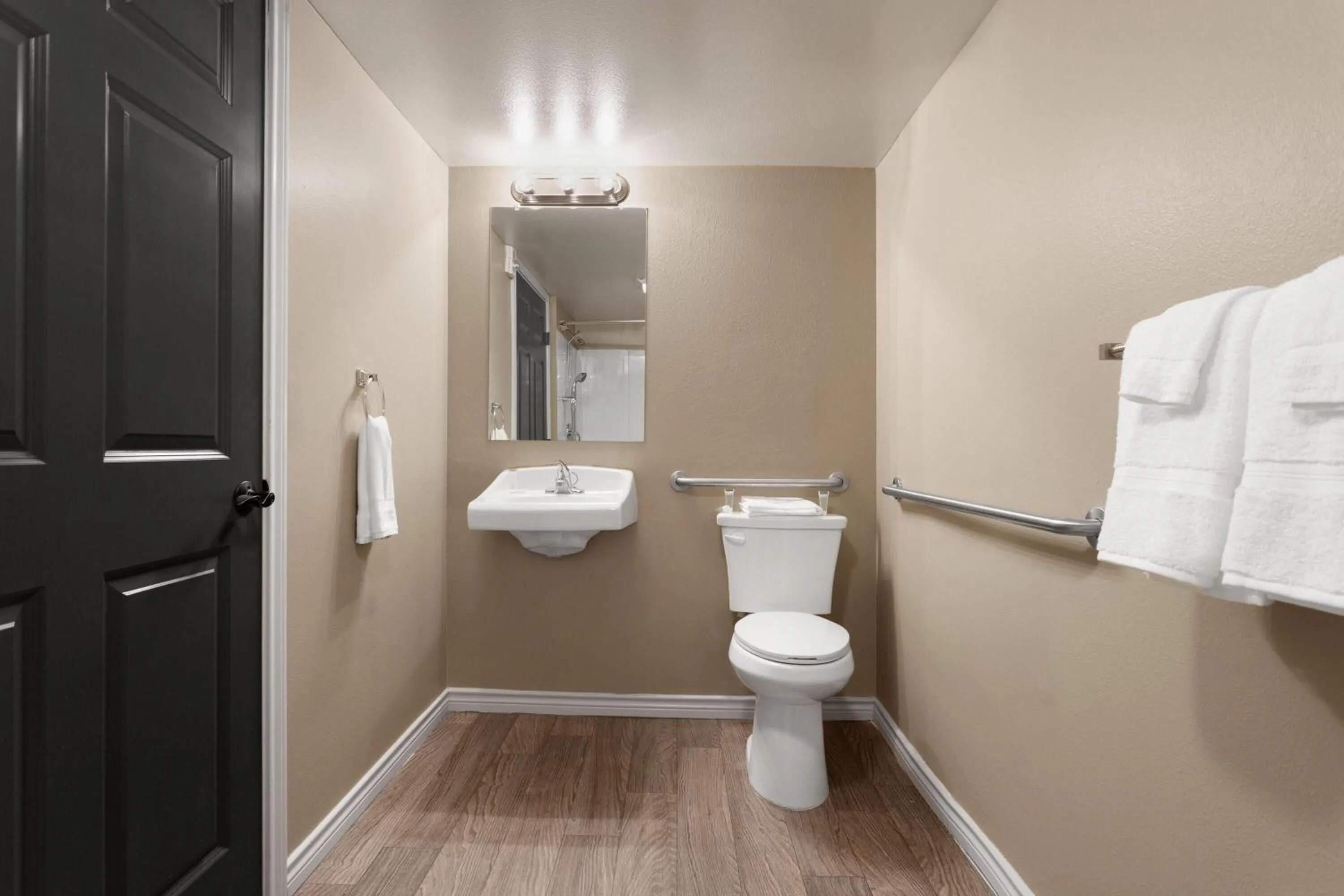 Toilet in Eagle's Den Suites Andrews a Travelodge by Wyndham