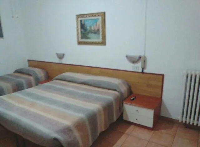 Photo of the whole room in Albergo Cavour SELF CHECK-IN