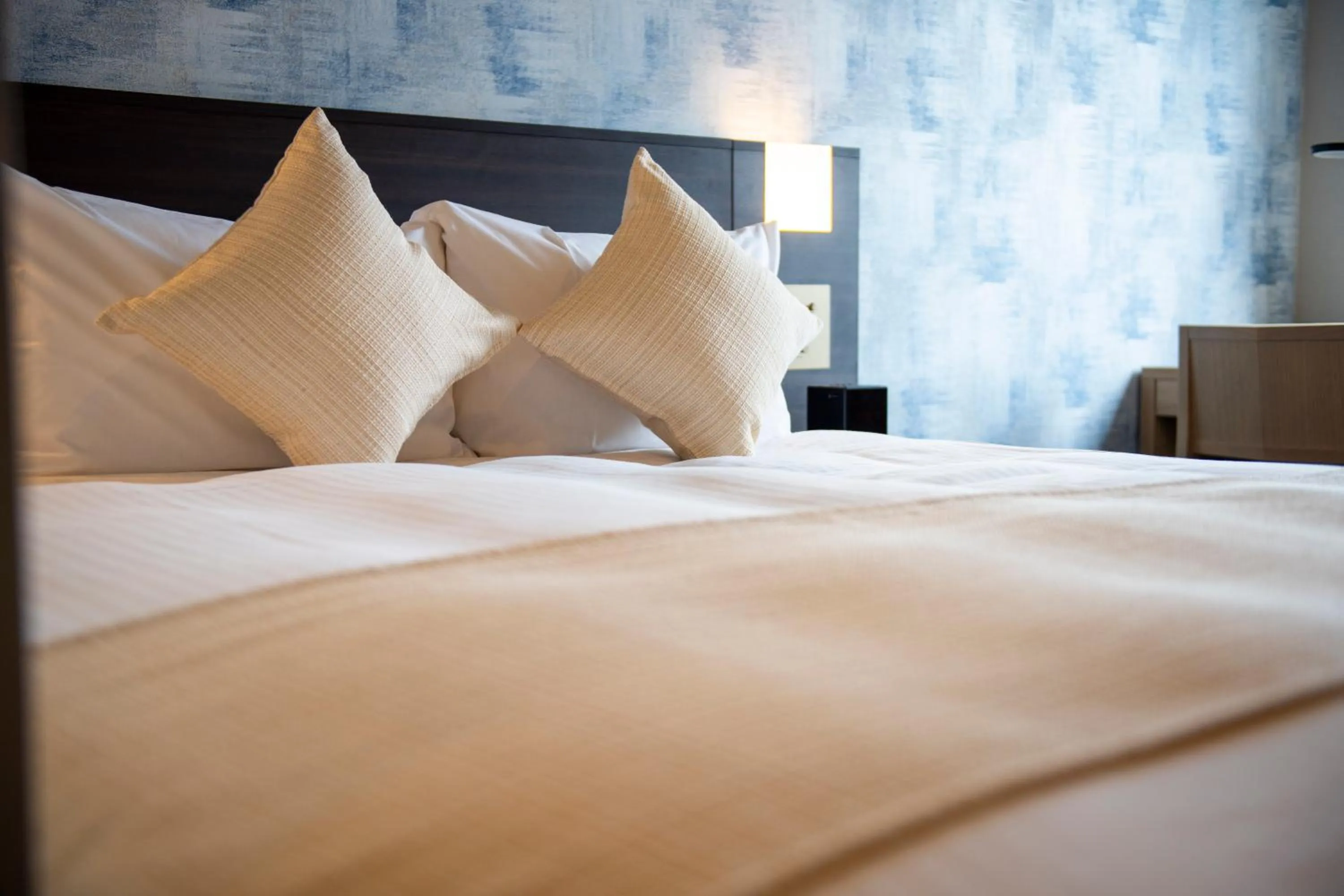 Bed in KOKO HOTEL Sapporo Odori