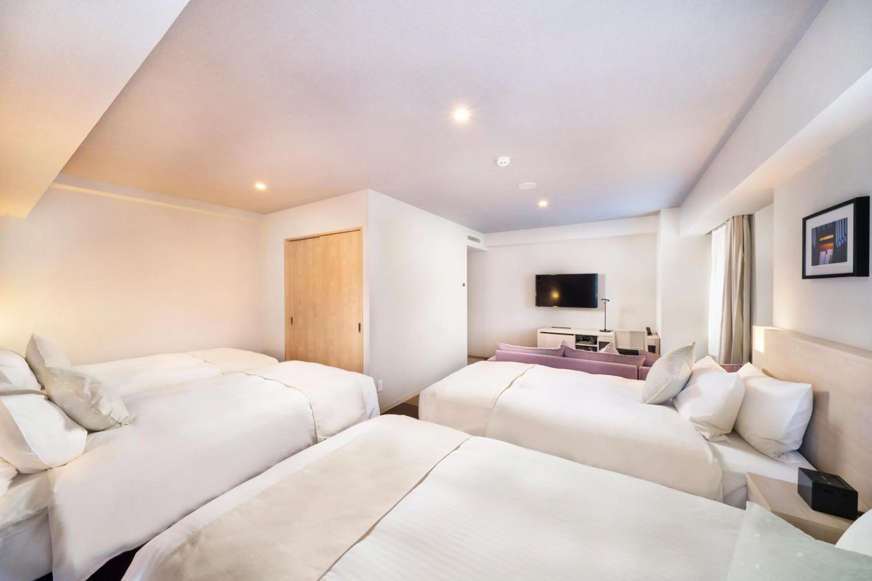 Bed in KOKO HOTEL Sapporo Odori