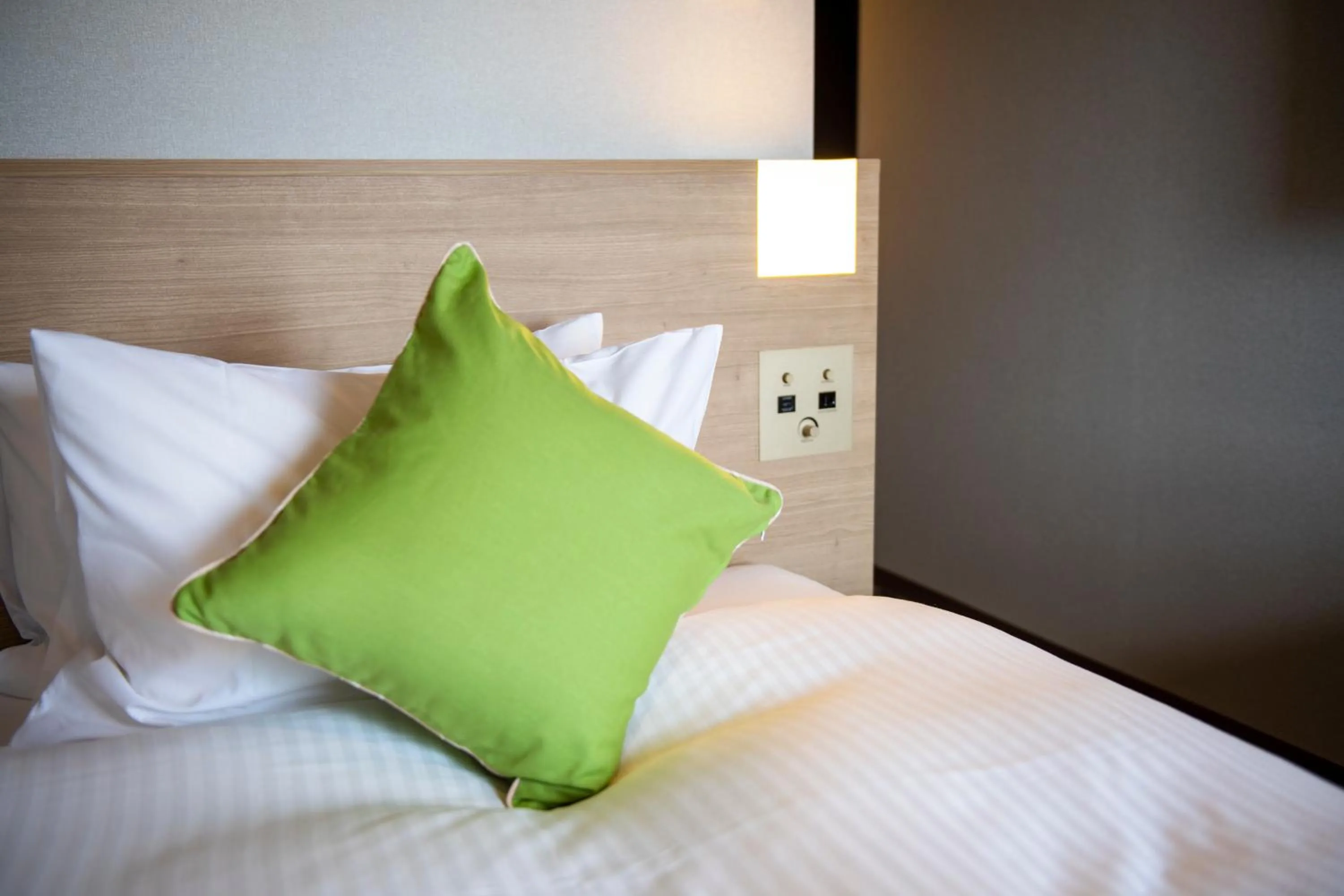 Bed in KOKO HOTEL Sapporo Odori