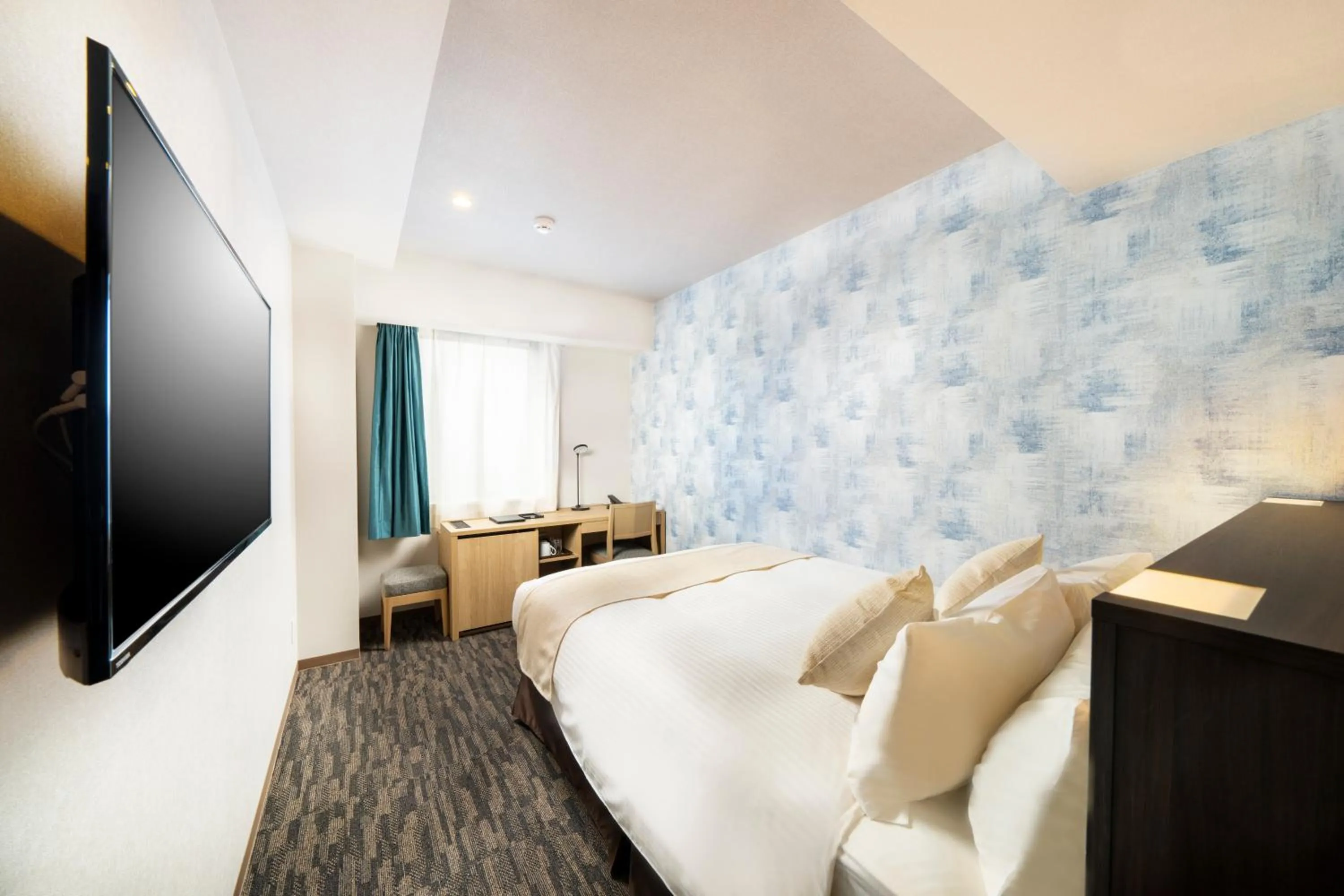 Bed in KOKO HOTEL Sapporo Odori