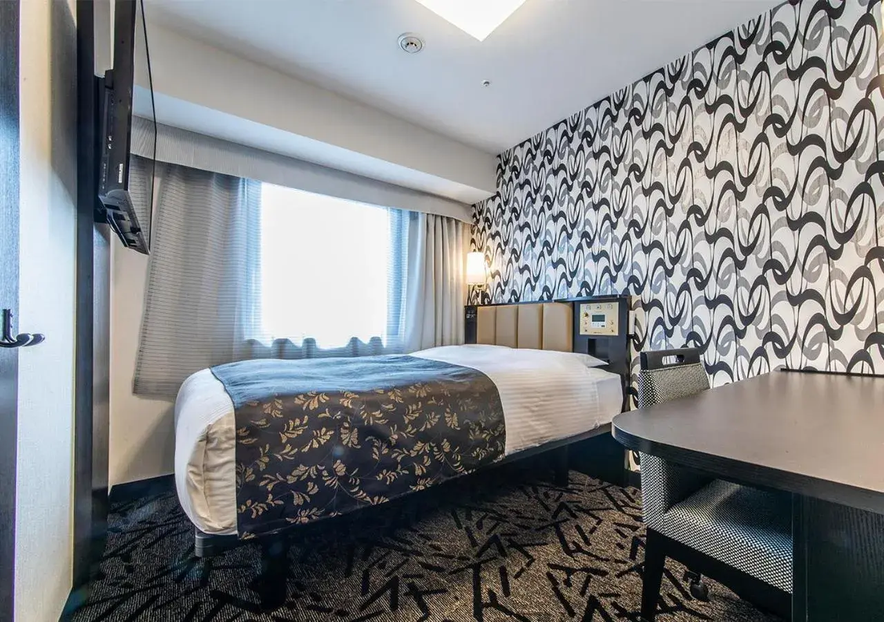 Bed in APA Hotel Kobe Sannomiya Ekimae Bed in APA Hotel Kobe Sannomiya Ekimae