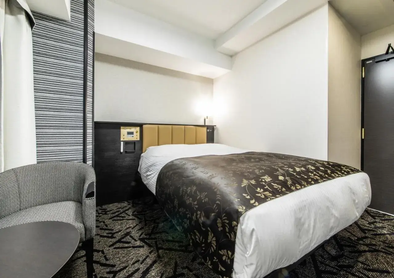 Bed in APA Hotel Kobe Sannomiya Ekimae Bed in APA Hotel Kobe Sannomiya Ekimae